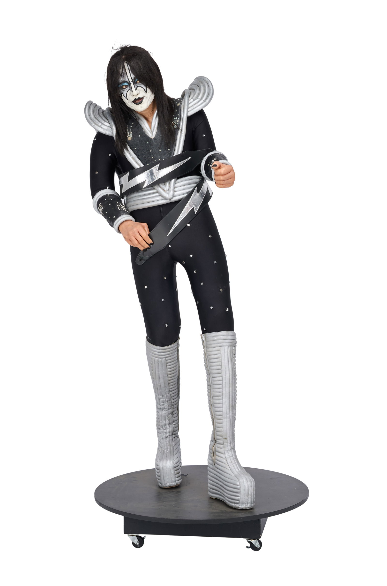 KISS | Ace Frehley Life-Size Destroyer Costume Mannequin with Signed Sheet Music: A life-size custom mannequin created with a life cast of Ace Frehley of KISS, including a detailed silicone life cast head and hands, by Joe Petra. The mannequin is displayed on a wooden circular base