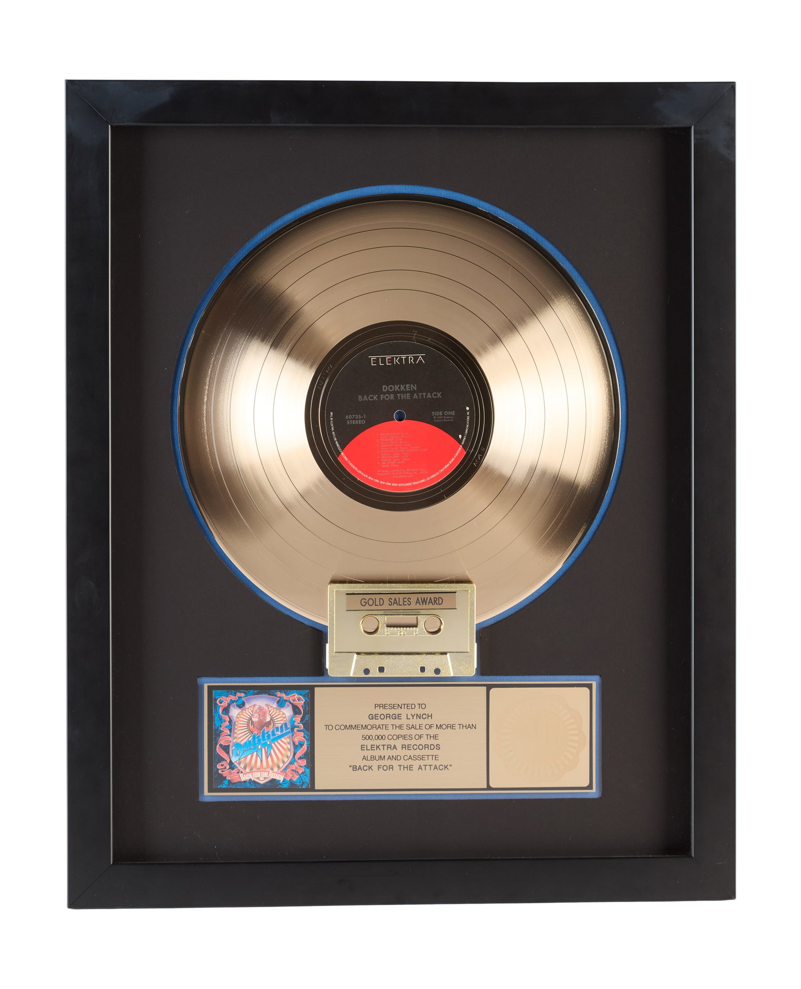 Dokken | RIAA "Gold" Sales Award Presented To George Lynch for "Back for the Attack": An RIAA certified "Gold" Sales Award presented to guitarist George Lynch to commemorate the sale of more than 5,000,000 albums and cassette copies for Dokken's 1987 studio album Back for the Attack. R