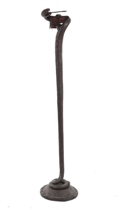 Slash | Bronze Serpent Torchiere: An Art Deco style bronze torchiere in the form of a coiled serpent after an original design by Edgar Brandt, from the personal collection of Slash. 
