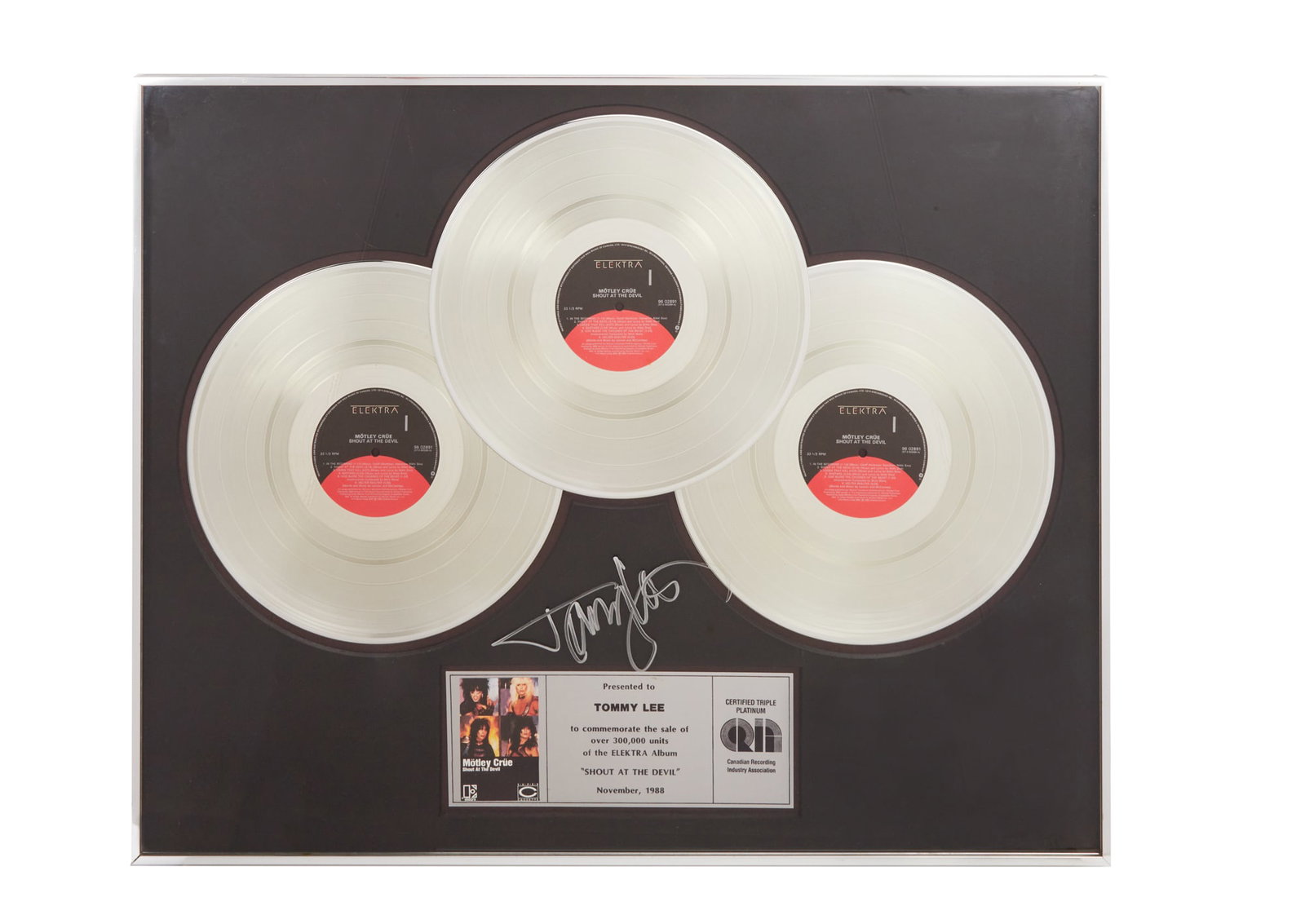 Tommy Lee | Signed CRIA Triple-Platinum Sales Award for Shout at the Devil by Motley Crue: A CRIA Certified "Triple-Platinum" sales award presented to Tommy Lee to commemorate the sale of more than 300 000 copies of Motley Crue's 1983 studio album Shout at the Devil. Signed by Lee on the
