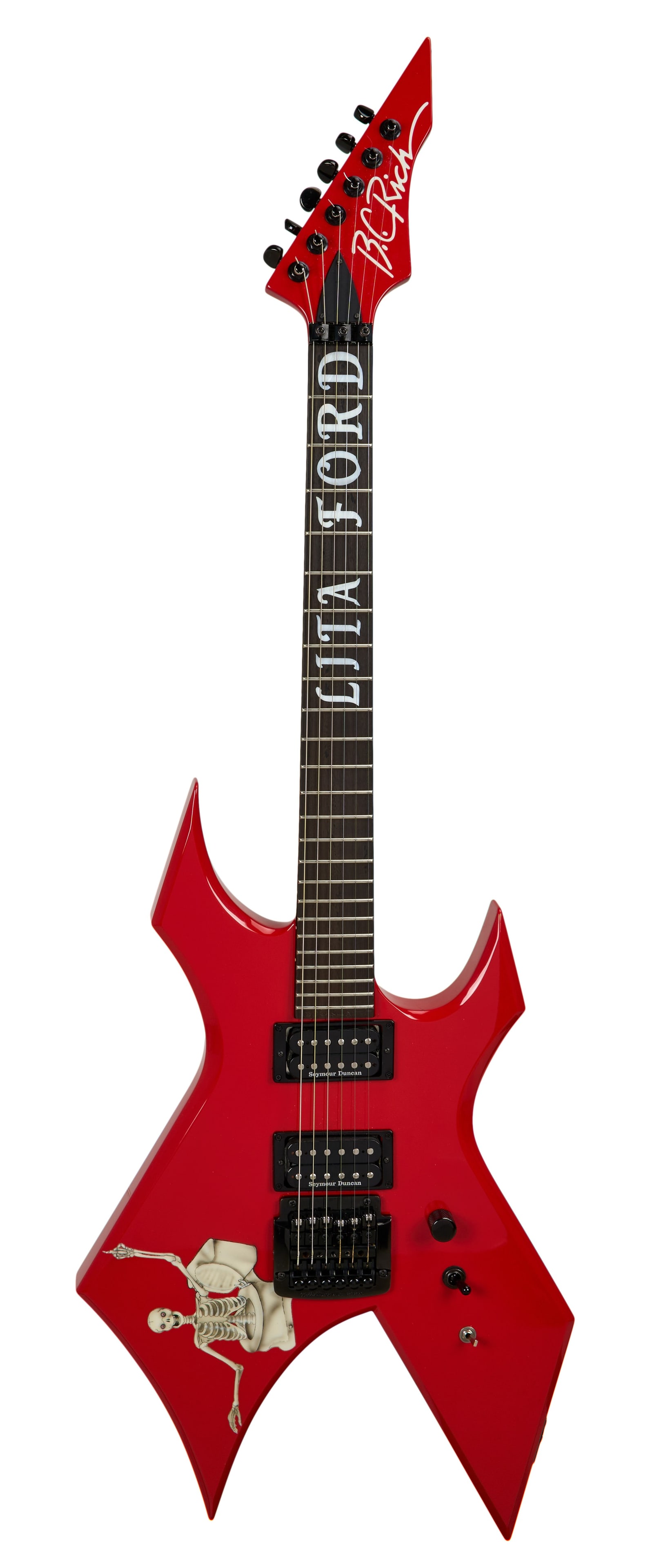 Lita Ford | Stage Played and Signed 2014 B.C. Rich Warlock, Red: A stage played and signed 2014 B.C. Rich Warlock electric guitar owned and played by lead guitarist and solo artist Lita Ford, formerly of The Runaways. Lita has signed the back of the guitar in black