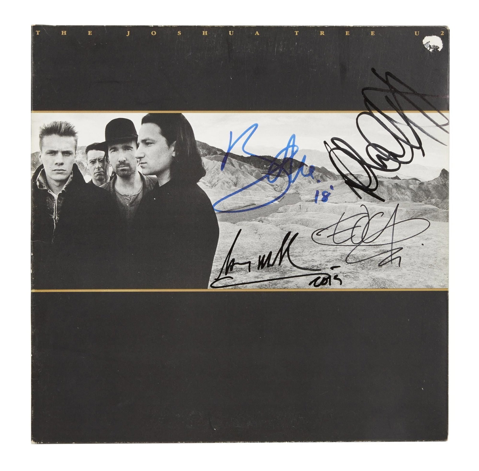 U2 | Band Signed "The Joshua Tree" Record Album: A vinyl pressing of U2's 1987 album, The Joshua Tree, signed by all four members of the band in marker: Bono in blue, the others in black.