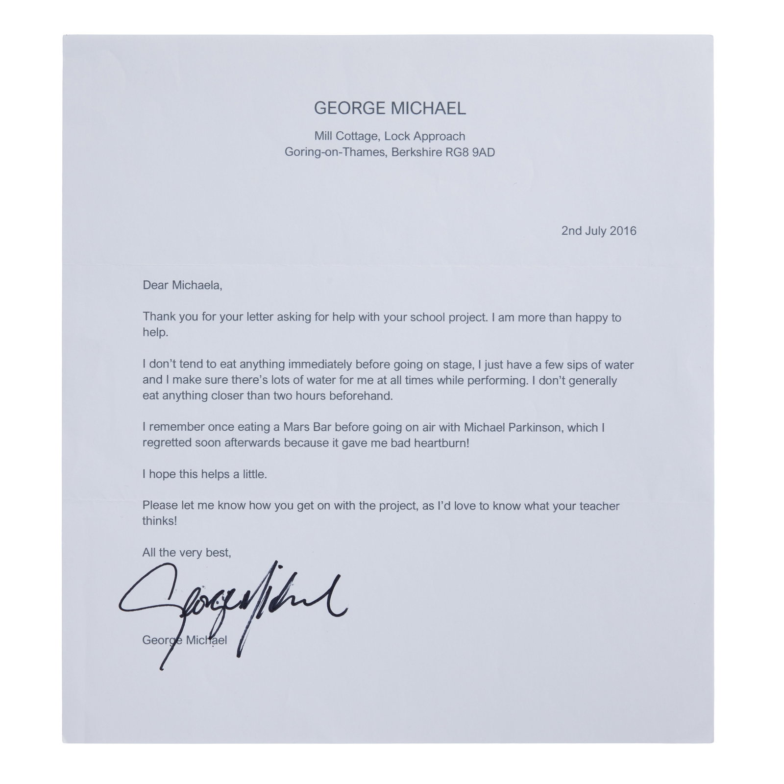George Michael | 2016 Signed Letter: A typed letter from George Michael to a school child named "Michaela," signed by him in black marker. The letter addresses a question posed to him about what he eats before going on stage and is dated
