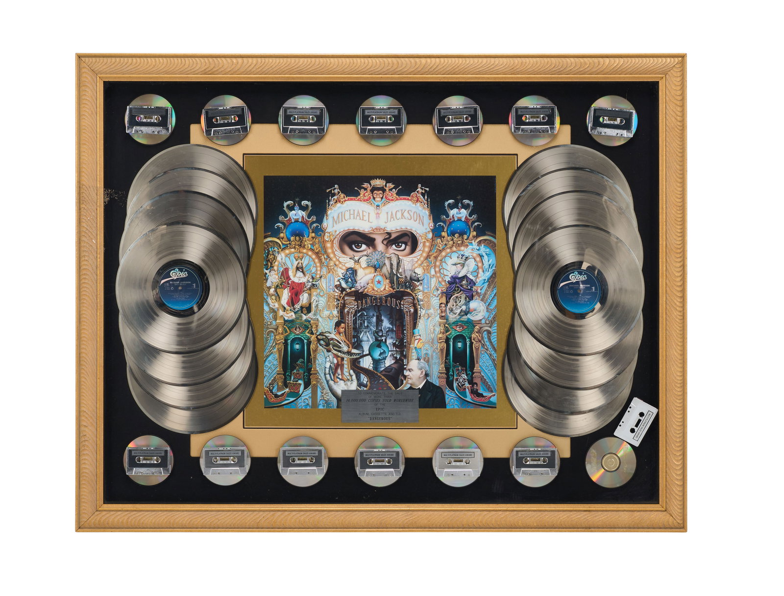 Michael Jackson | In-House award of Dangerous: This is an award presented to Michael Jackson to commerate the sale of 14,000,000 album, cassette, and CD copies of his album Dangerous. 