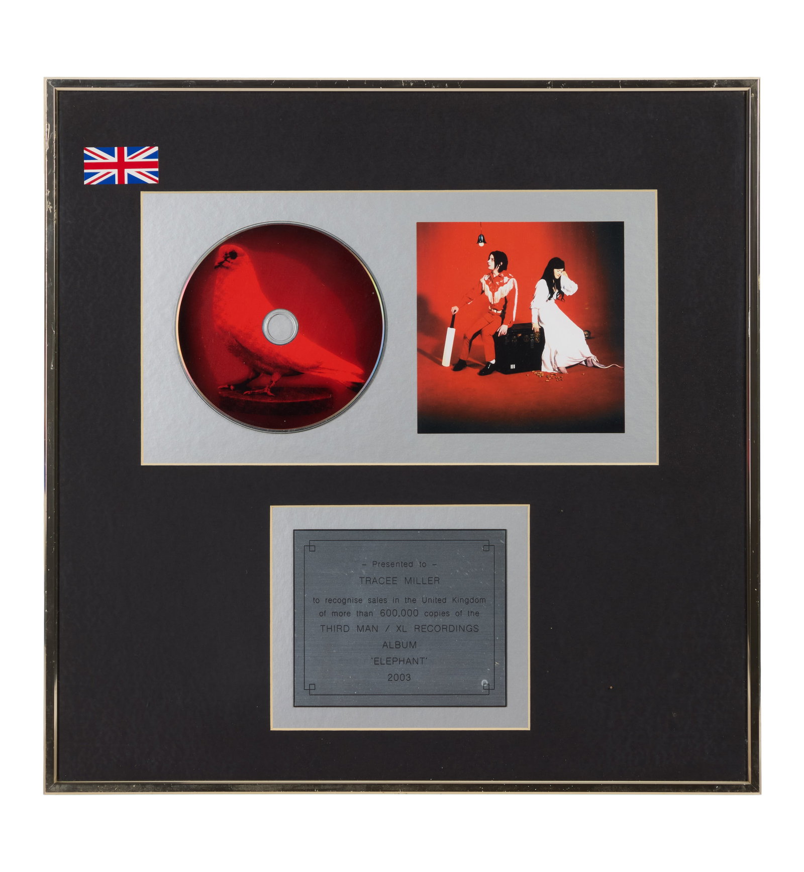 The White Stripes | RIAA Certified "Gold" Sales Award for "Elephant" Presented to Tracee Mae Miller: An RIAA-Certified "Gold" Sales Award presented to Tracee Mae Miller to commemorate more than 600,000 CD copies of The White Stripes' 2003 studio album Elephant. Released on April 1, 2003, Elepha