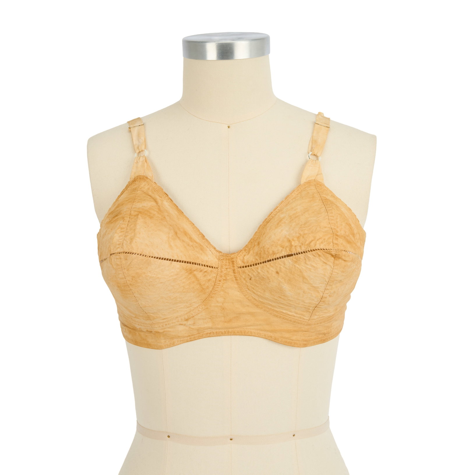 Marilyn Monroe | 1950s Brassiere: An undergarment made of tan cotton; partially worn-off label reads in part "?of Hollywood / ?C-36, / Style 1626"; now yellowed due to age; from the star's personal possessions as inherited by Lee and