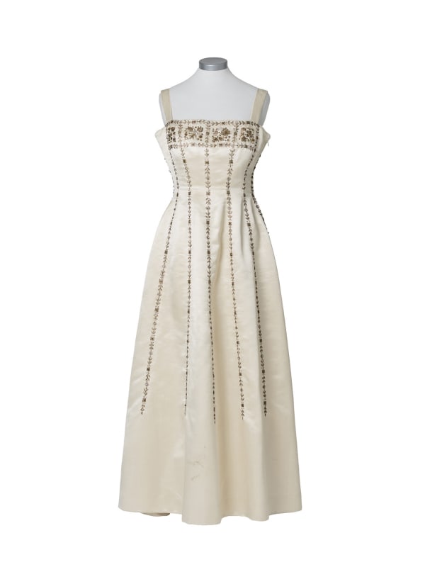 Marilyn Monroe | 1950s Elegant Evening Gown: A garment made of ivory-colored natural silk; wide shoulder straps, square neckline, floor-length, embellished with gold-tone thread, sequins, rhinestones, and miniscule faux pearls on both front and