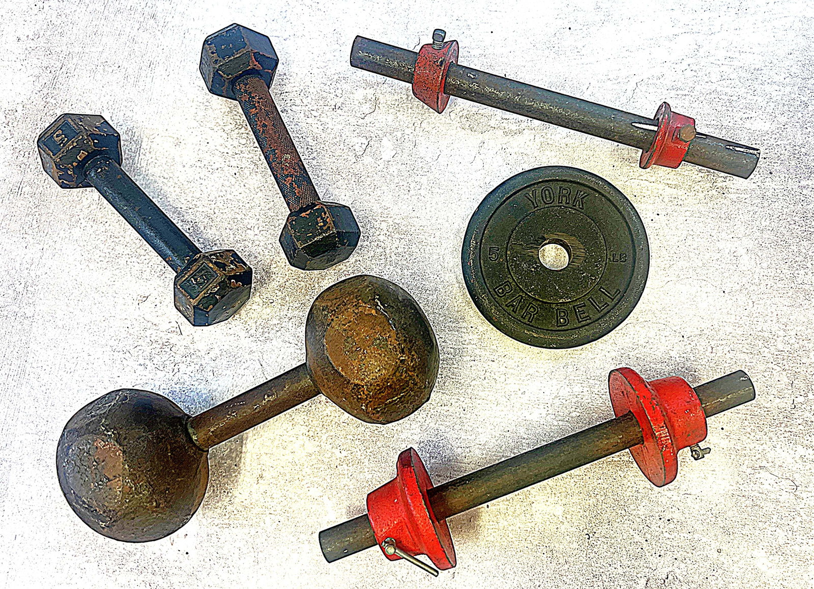 Marilyn Monroe | 1950s Hand Weights: A group of six pieces; made of metal, together weighing approximately 70 pounds, including a set of 5-pound dumbbells, a single 40-pound dumbbell, one 10-pound barbell, one 3-pound barbell, and one 5-