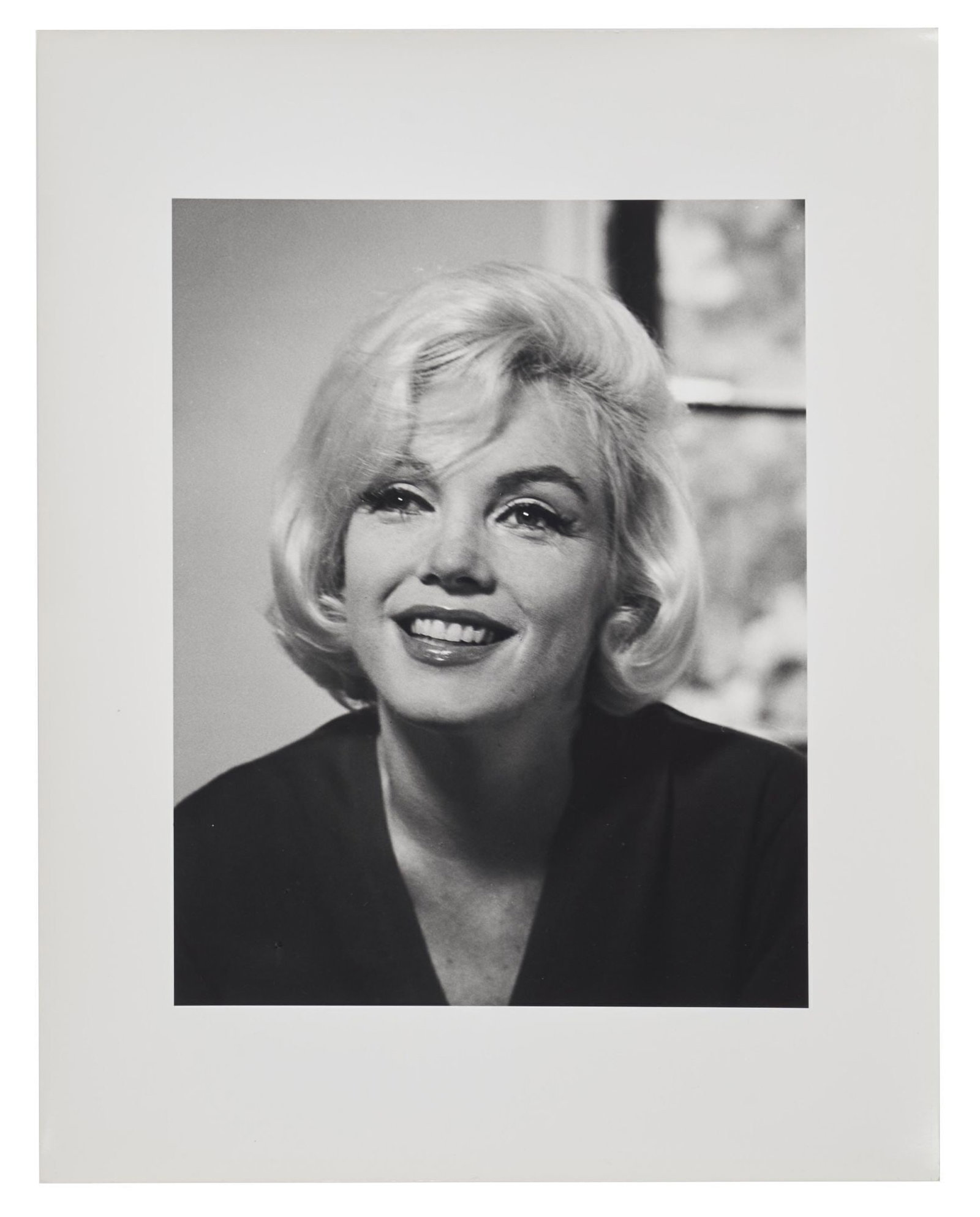 Marilyn Monroe | 1962/1980s Never-Published Black and White Photograph by Allan Grant: A circa 1980s later print hand-printed by Allan Grant; unusual format of an 10"x8" printed on 14"x11" paper with wide white borders, glossy finish, double-weight paper, depicting a close-up of the