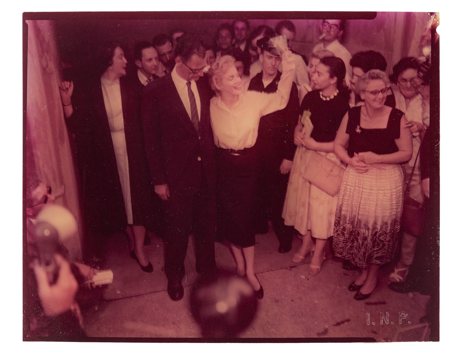 Marilyn Monroe | 1956 Arthur Miller-Related Rare Color Transparency: An original print; on film, depicting the star in June 1956 alongside her then fianc? Arthur Miller, journalists, a policeman, photographers, and onlookers as the couple announce their marriage plans