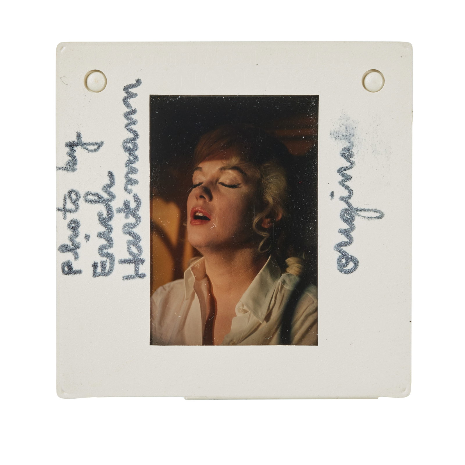 Marilyn Monroe | 1960/1970s Rare Color Slide by Erich Hartmann from "The Misfits": United Artists, 1961; a piece housed in a circa 1970s plastic frame, depicting an unusual close-up of the star with her eyes closed and mouth open, a black felt-tip annotation on back side reads