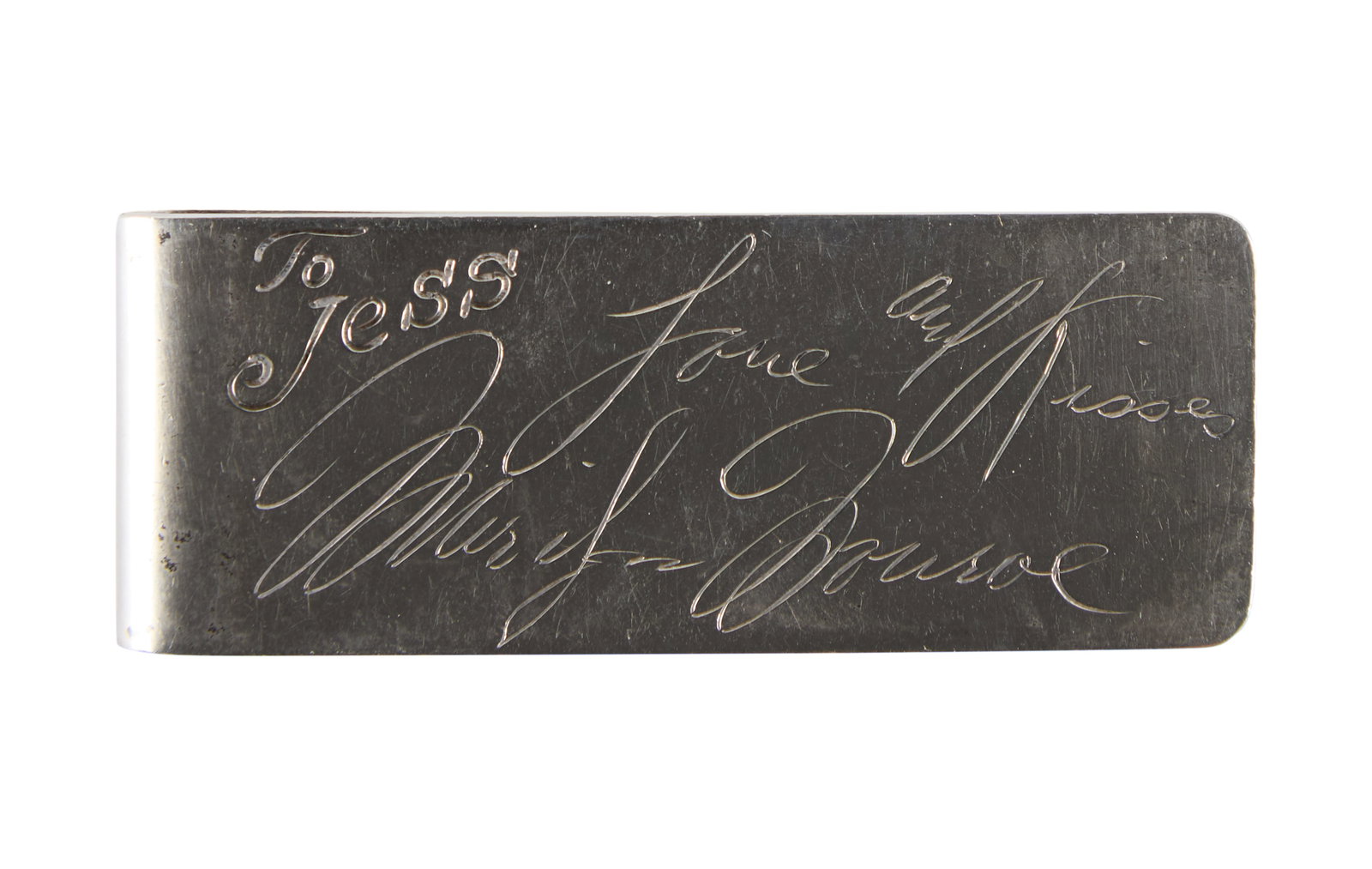 Marilyn Monroe | 1960 Sterling Silver Engraved Money Clip: A weighty piece at 38.6 grams; engraved on front "To / Jess" and then in Marilyn's facsimile hand "Love and Kisses / Marilyn Monroe"; back hallmarked "Sterling / CJS"; gifted by the star to Jesse Long