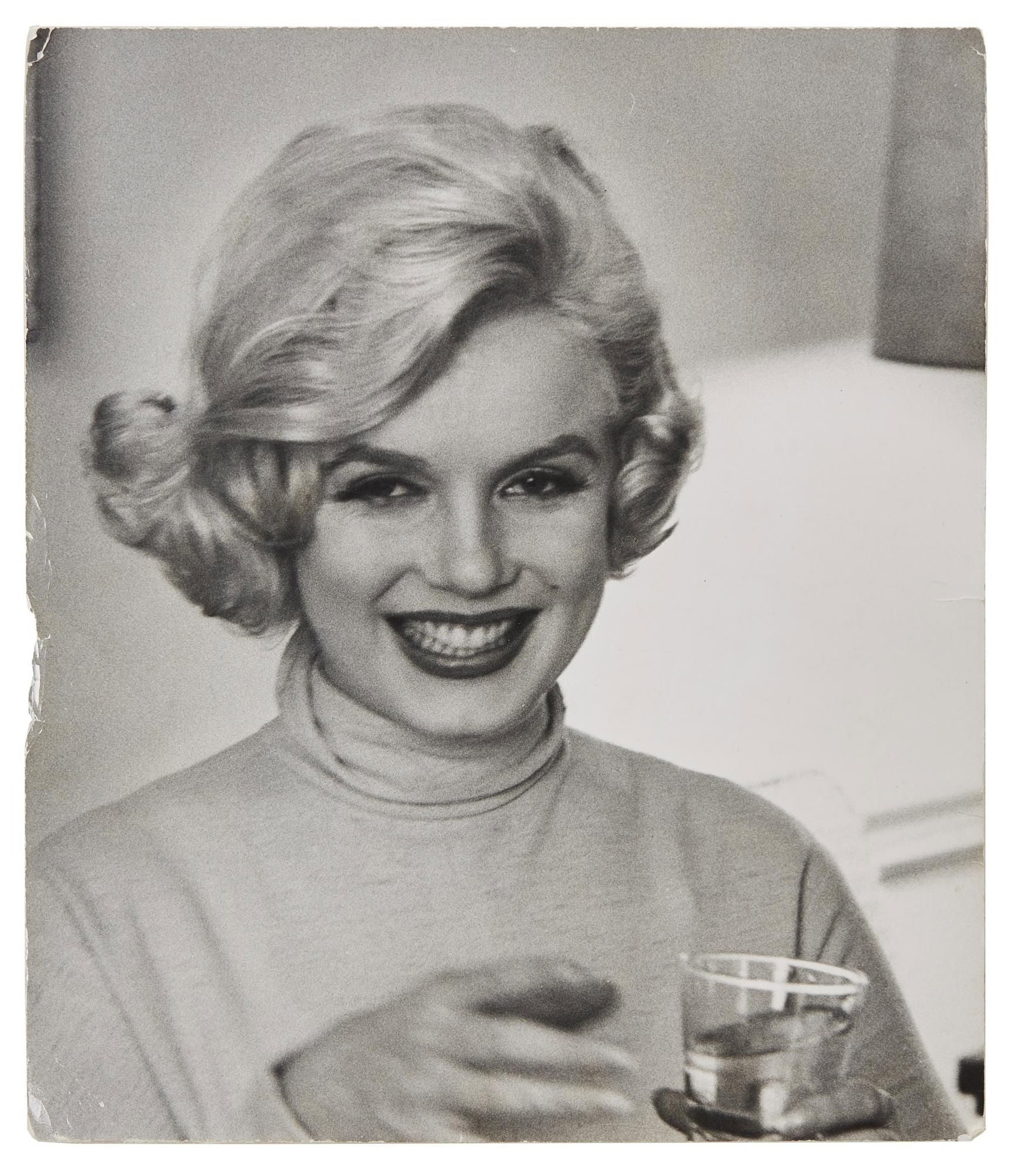 Marilyn Monroe | 1959 Black and White Photograph by Manfred Linus Kreiner: An original print; large format, semi-gloss finish, double-weight paper, depicting the star holding a glass of water at the Ambassador East Hotel in Chicago when she was there promoting her film "Some