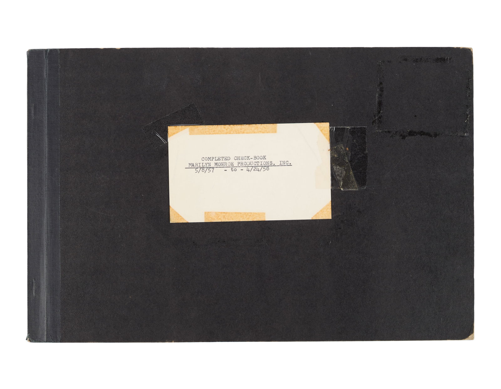 Marilyn Monroe | 1957-1958 Checkbook Stub Register: A black bound binder; a label taped to the front has a typed note reading in part "Completed Check-Book / Marilyn Monroe Productions, Inc.," inside pages document the checks written out from the star'
