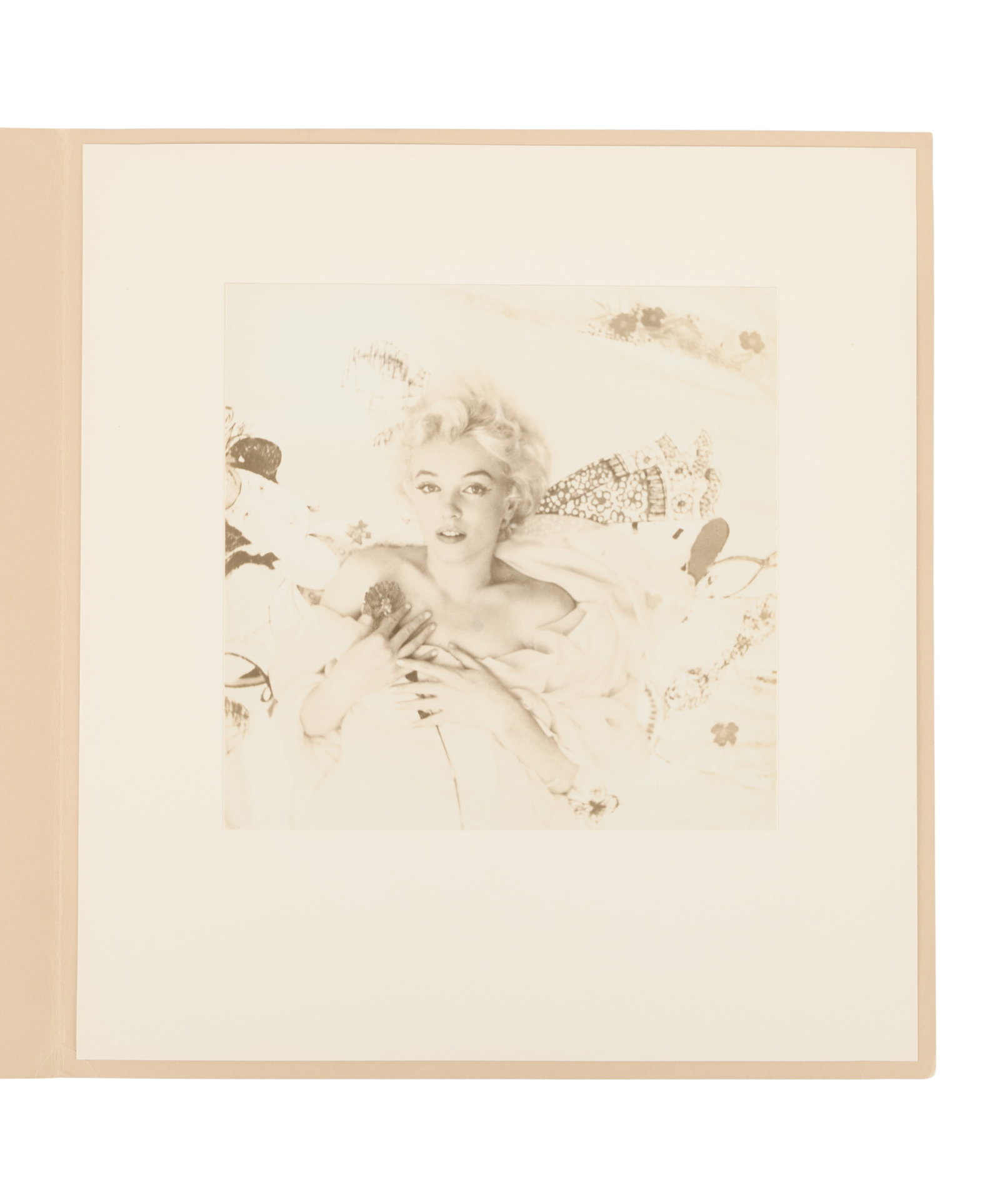 Marilyn Monroe | 1956 Personally-Owned Sepia Photograph by Cecil Beaton: An original print; large square-ish format [15"x14"], matte finish, depicting the star in her fabled "favorite photo of herself" -- you know the one -- where she's holding a flower as she rests agains