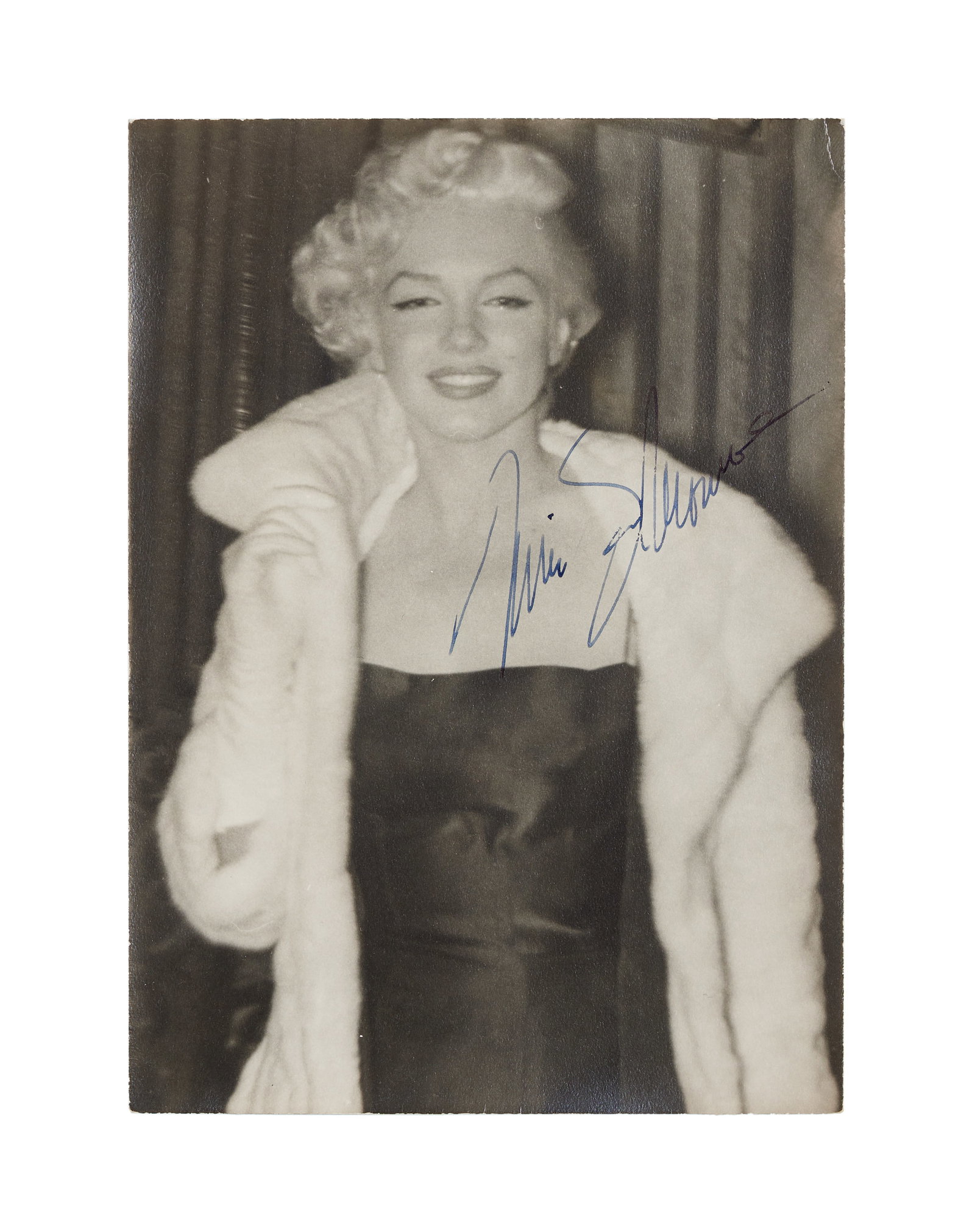 Marilyn Monroe | 1955 Signed Black and White Snapshot from the Estate of Frieda Hull: An original print; matte finish, double weight paper, depicting the star on her way to Jackie Gleason's birthday party in NYC on February 26, 1955, signed in blue fountain pen ink on the middle right 