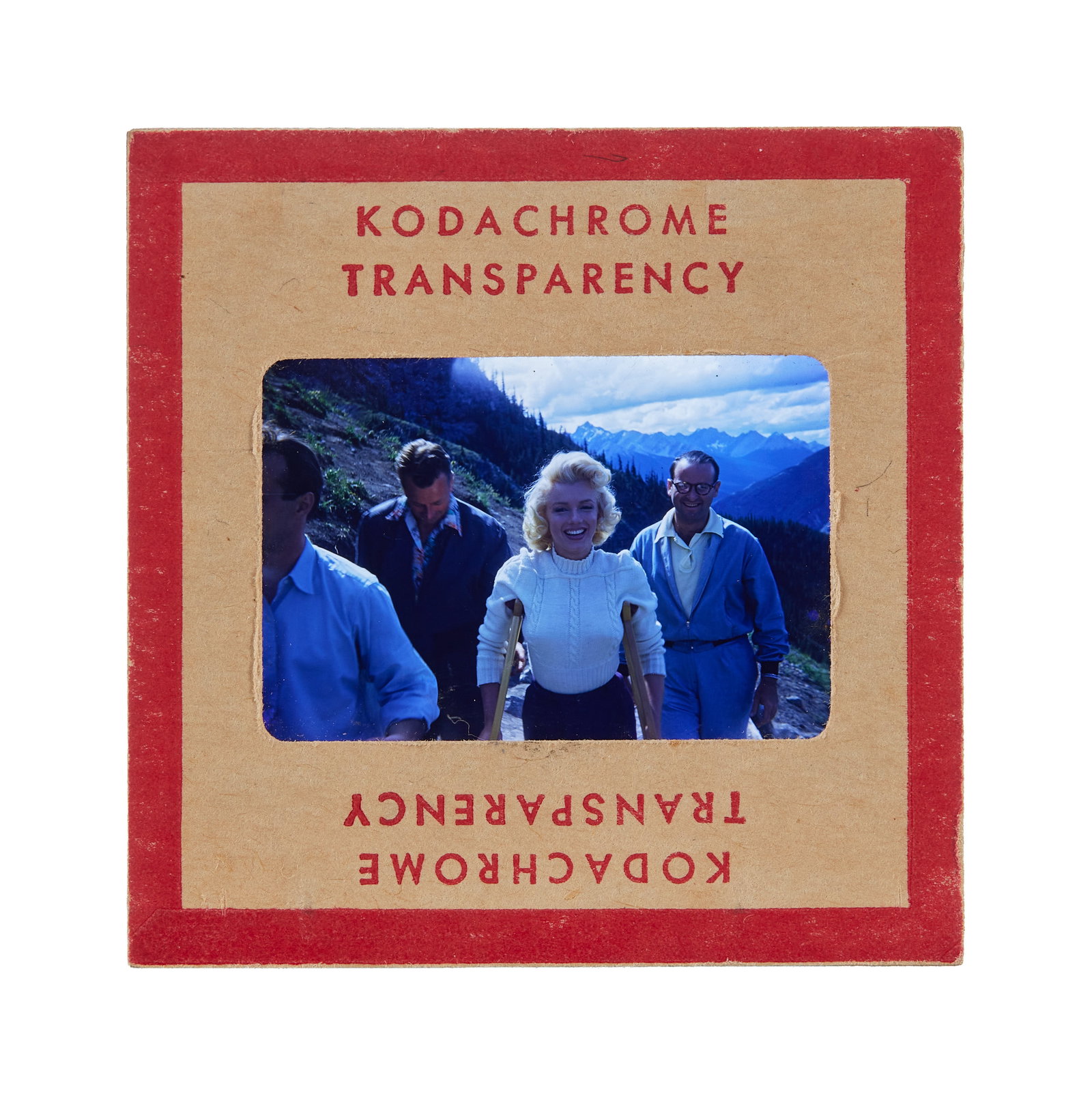 Marilyn Monroe | 1953 Never-Before-Seen Color Slides Related to "River of No Return": A group six; original prints, housed in cardboard sleeves with text on one side reading "Kodachrome / Transparency" and on the other "Made in U.S.A.," all depict the star wearing a white turtleneck sw