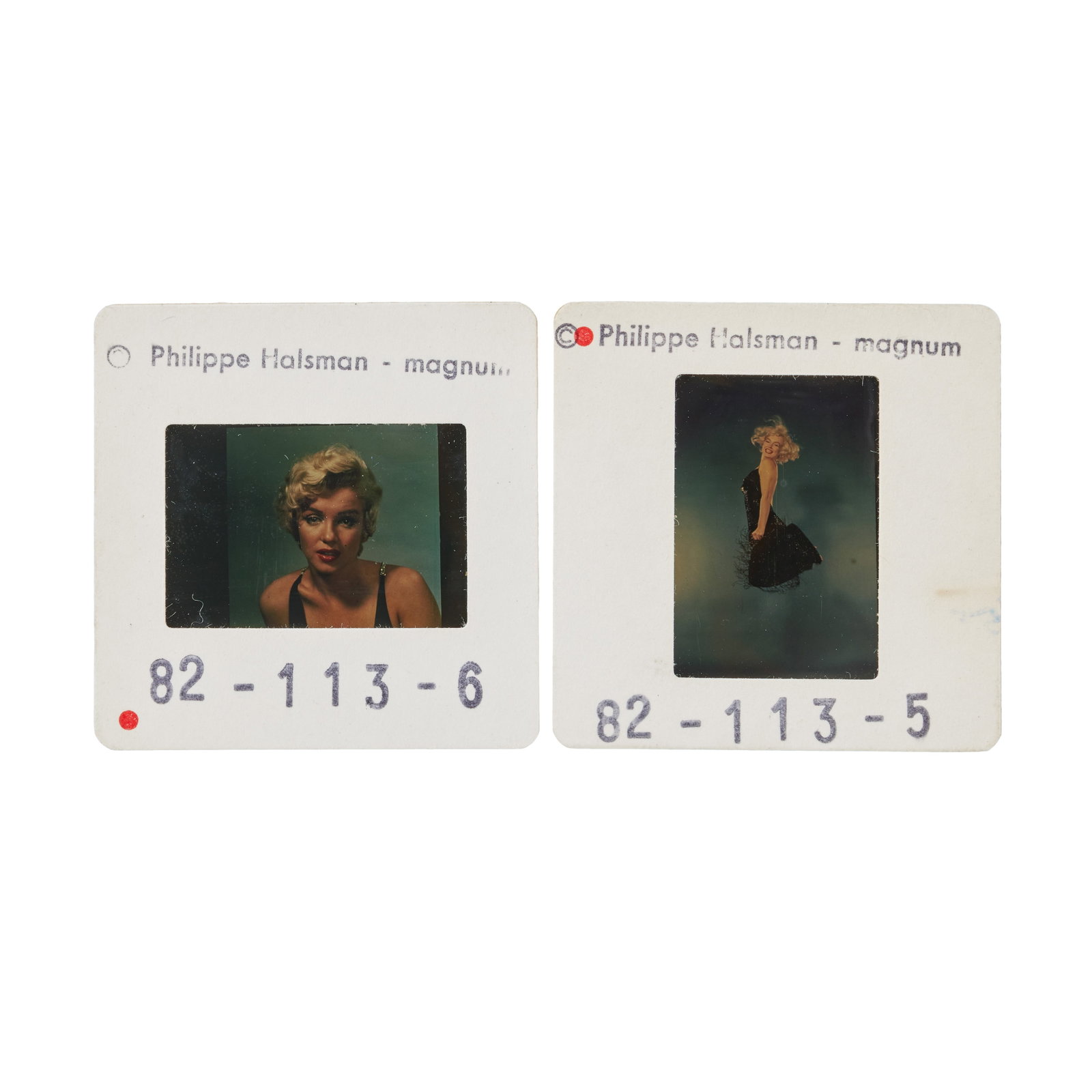 Marilyn Monroe | 1954/1959/1960s Color Slides by Philippe Halsman: A group of two; both housed in circa 1960s cardboard sleeves stamped in black in part on upper margin "Philippe Halsman - Magnum," the first depicts the star in 1954 in a close-up with a serious expre