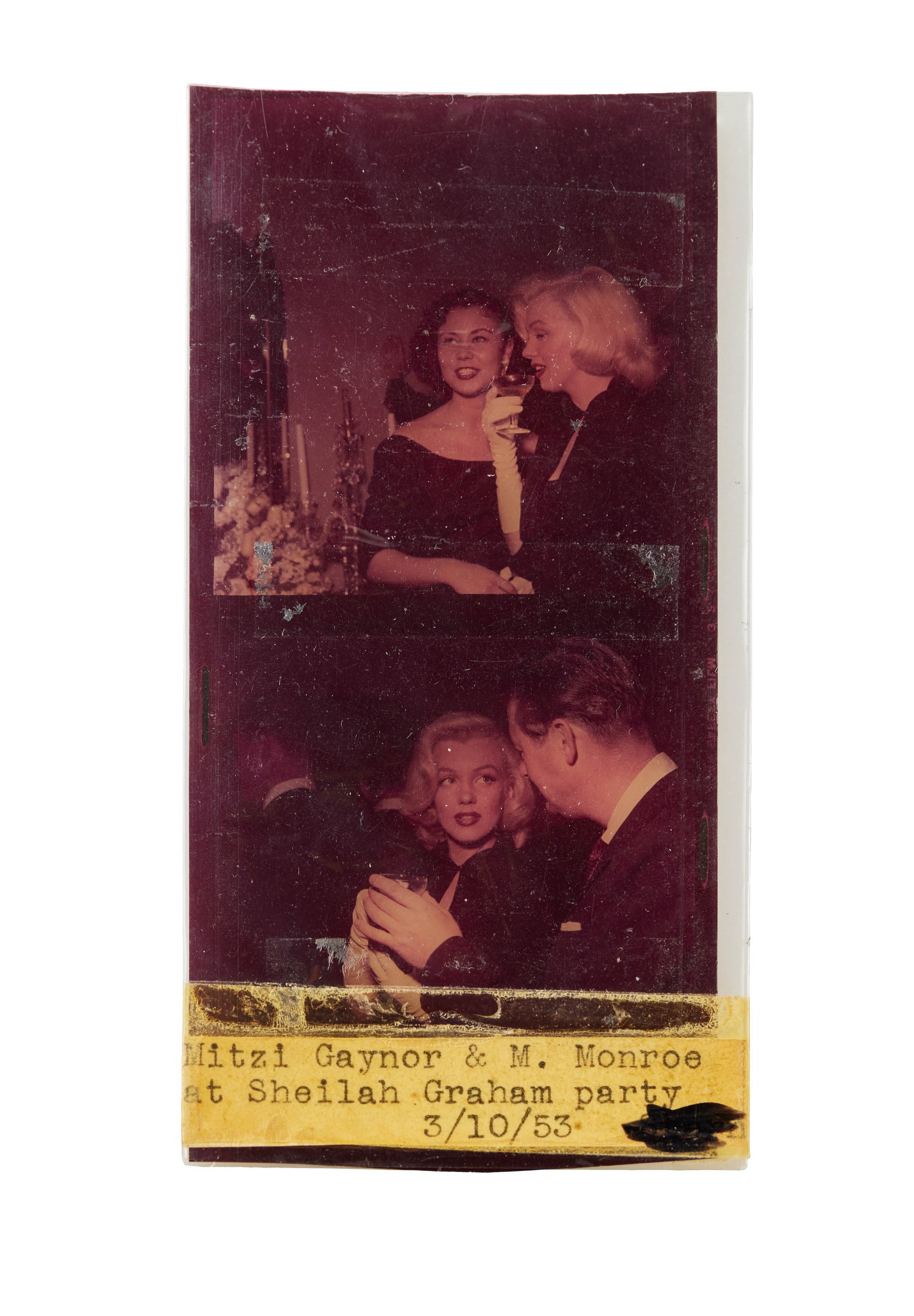 Marilyn Monroe | 1953 Rare Color Transparency: An original print; on film, depicting two images attached to each other; the top one shows the star with Mitzi Gaynor, and the bottom one shows her with a male character actor; both are housed in a