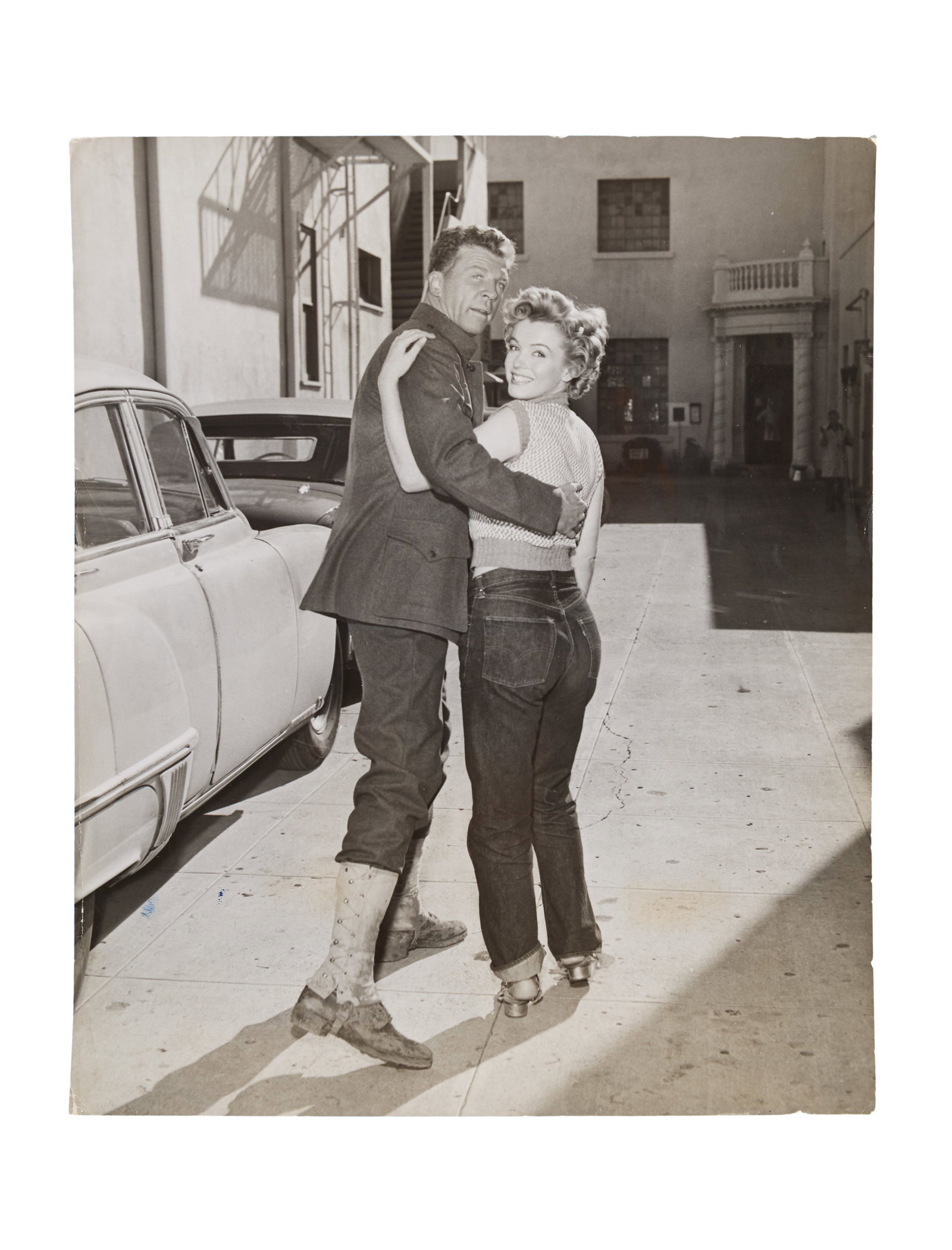 Marilyn Monroe | 1953 Black and White Photograph: An original print; glossy finish, depicting the star with Dan Dailey on the back lot at 20th Century Fox, verso with a typed press snipe reading in part "Blonde Marilyn Monroe takes time off from her