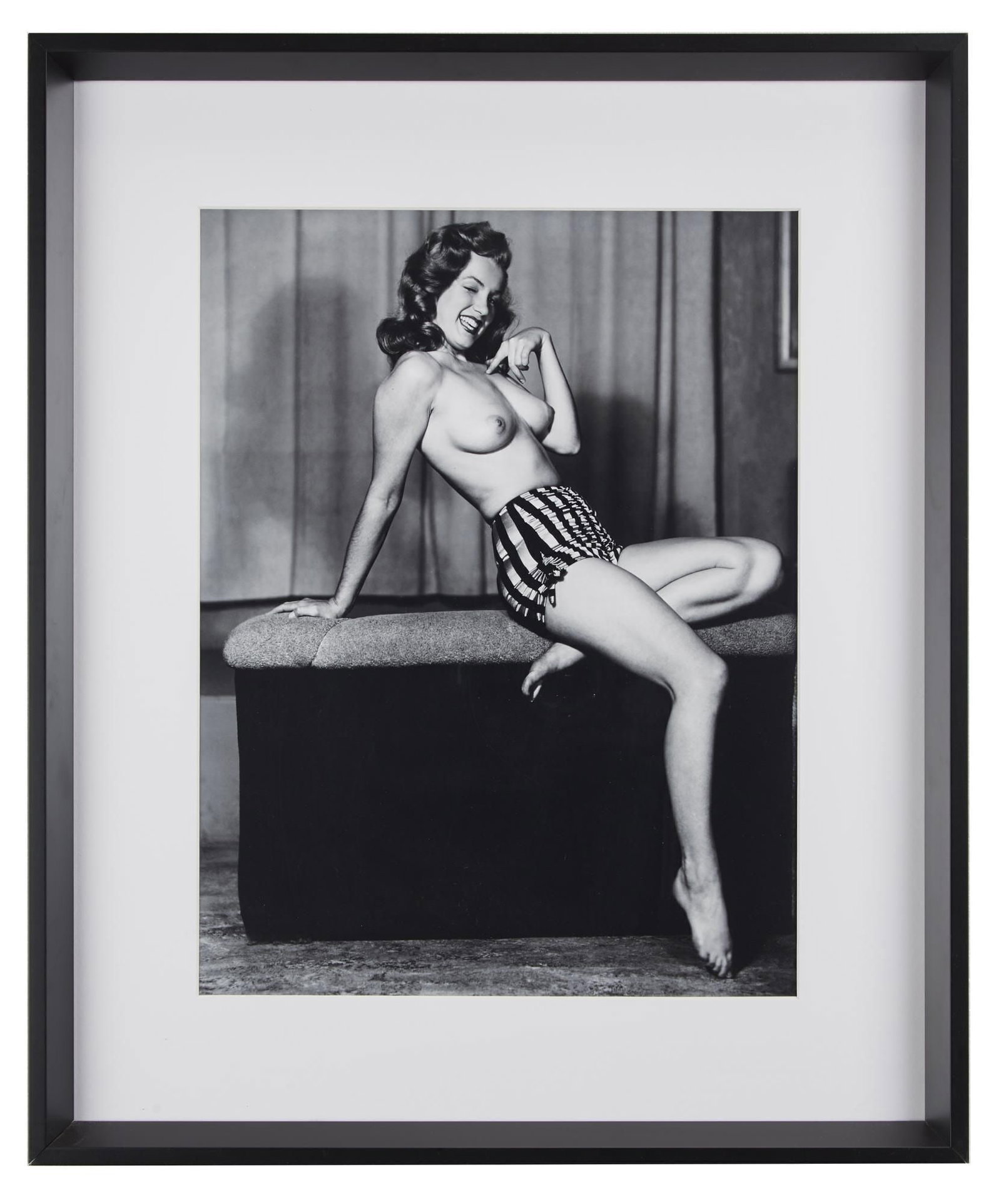 Marilyn Monroe | Circa 1946/1990s Black and White Photograph by Earl Moran: A circa 1990s later print; large format, semi-gloss finish, depicting the then unknown model smiling as she wears a cute striped bathing suit bottom and nothing else; beautifully matted and housed in 