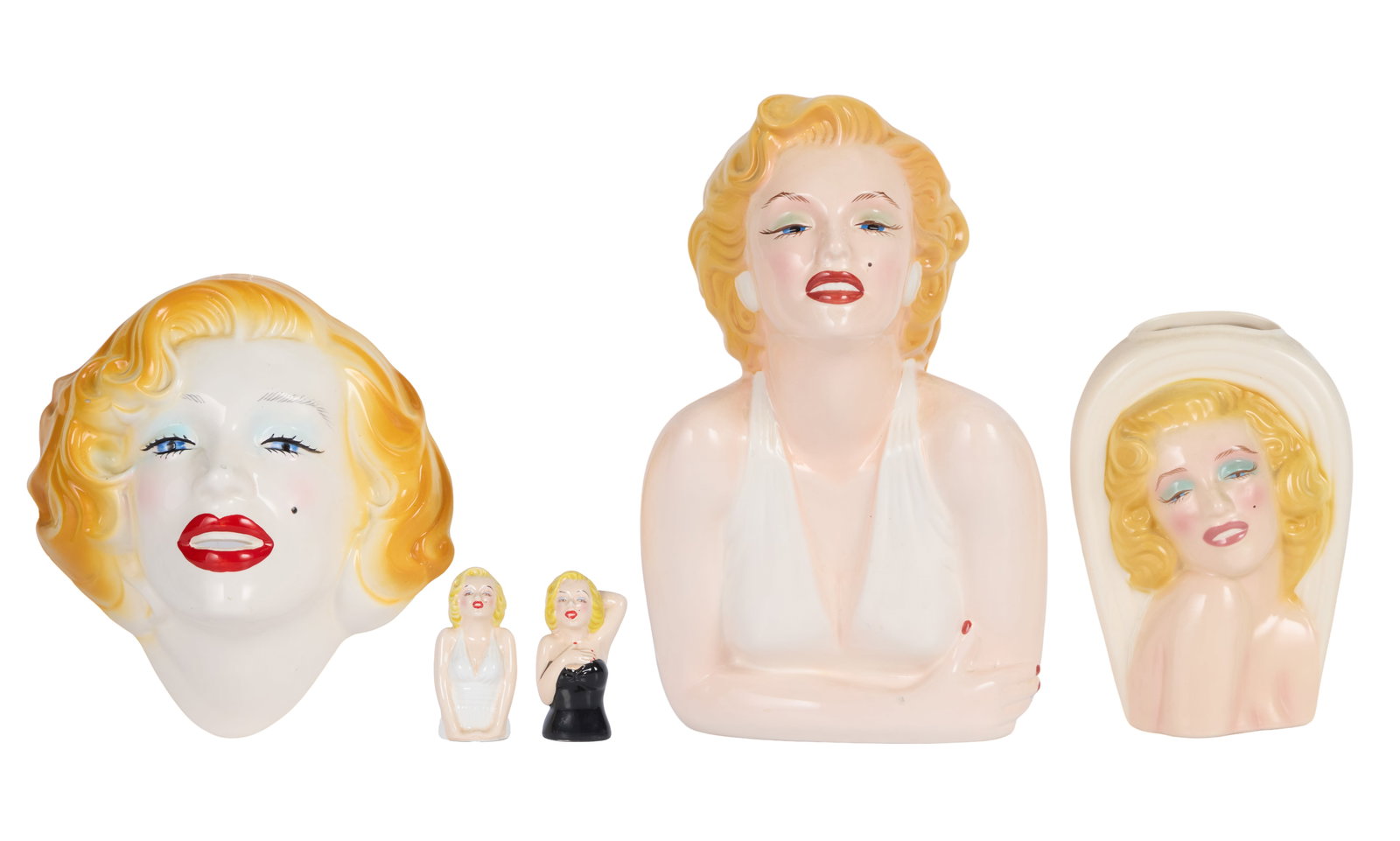 Marilyn Monroe | 1990s Collectibles by Clay Art: A group of four items; all made of ceramic in the likeness of the star, including: a cookie jar (please note lid has evident repair work), a "Clay Art" hallmark stamped on bottom; a vase; a wall hangi