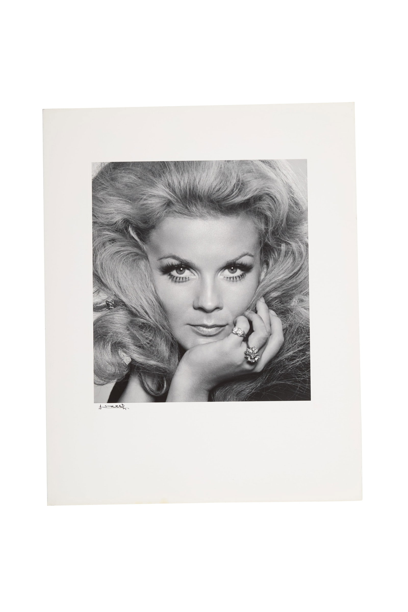 Ann-Margret | 1972 Black and White Photograph by Yousuf Karsh: An original print; semi-gloss finish, triple-weight paper with unusually wide borders, depicting a stunning headshot of the star with her two cocktail rings evident, signed in black fountain pen ink