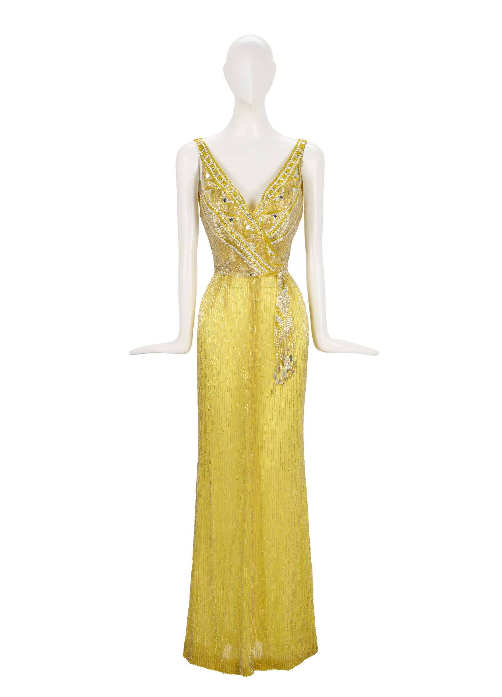 Ann-Margret | 1975 Ensemble by Elizabeth Courtney Worn to the Los Angeles Premiere of "Tommy": A garment made of bright yellow silk; entirely adorned with clear bugle beads and rhinestones, floor-length, wide spaghetti straps, attached dangling sash at left waist, back zip-up closure; label rea