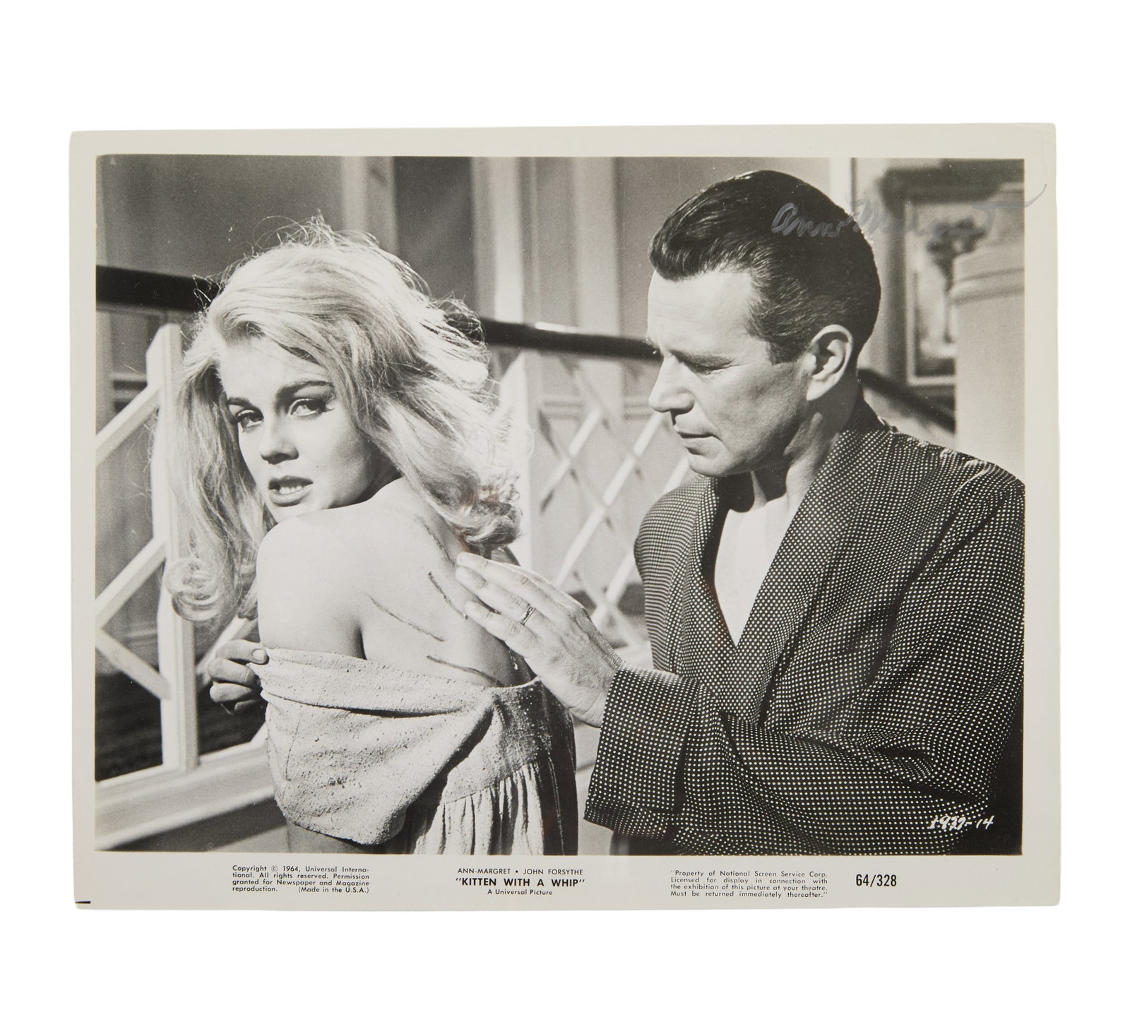 Ann-Margret | 1964/2026 Signed Black and White Film Still Photograph from "Kitten with a Whip": Universal, 1964; an original print; glossy finish, related text printed on the lower border, depicting the star and John Forsythe in a scene from their odd little psychosexual drama; signed recently