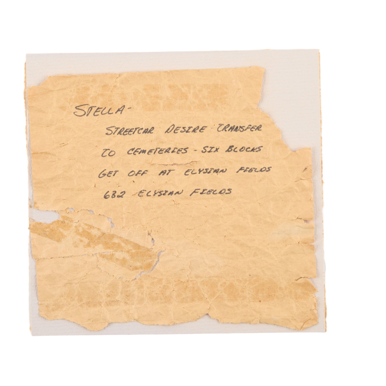Ann-Margret | 1984 Prop Note from "A Streetcar Named Desire": ABC Television, 1984; a small, crumpled piece of brown paper, handwritten text in black felt-tip ink reads in part "Stella - / Streetcar Desire Transfer / ?Get Off At Elysian Fields"; used by the