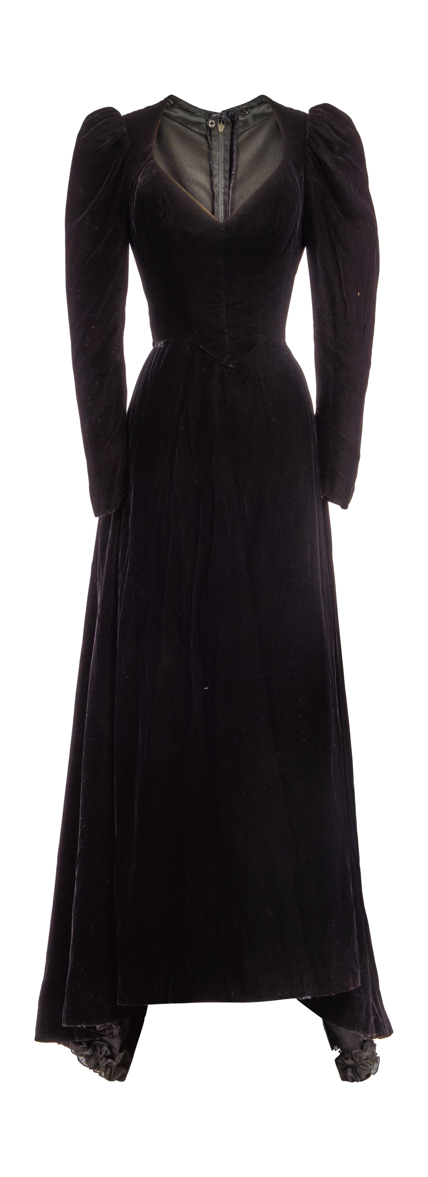 Ann-Margret | 1984 Gown Worn to the Golden Globe Awards When She Won for "Who Will Love My: A garment made of black velvet; floor-length, slight train at back hem, leg-of-mutton sleeves with zip-up closures on inner seam; V-neck, inner bustle-type padding to give waist area volume; back zip-