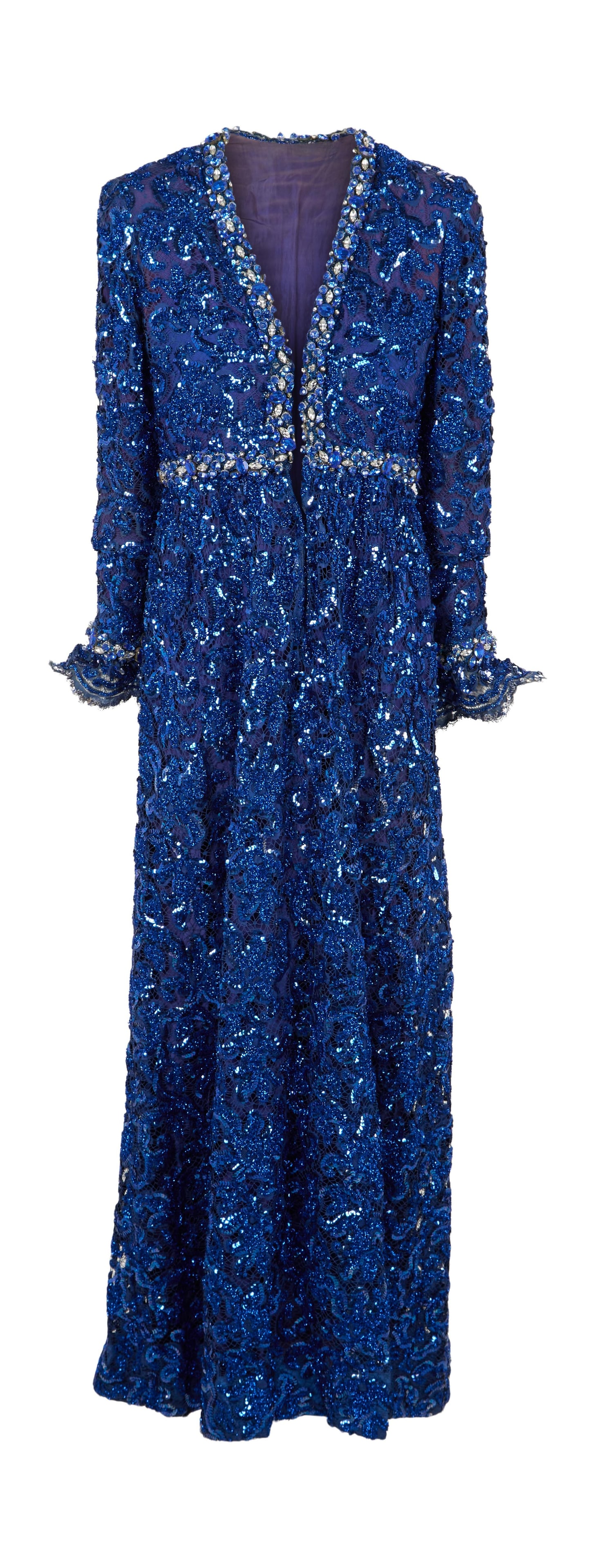 Ann-Margret | 1972 Royal Blue Gown by Oscar de la Renta: A garment made of royal blue silk; floor-length, with an overlay of same-color lace heavily adorned with same-color metallic thread and sequins, further adornment of large blue and clear faceted rhine