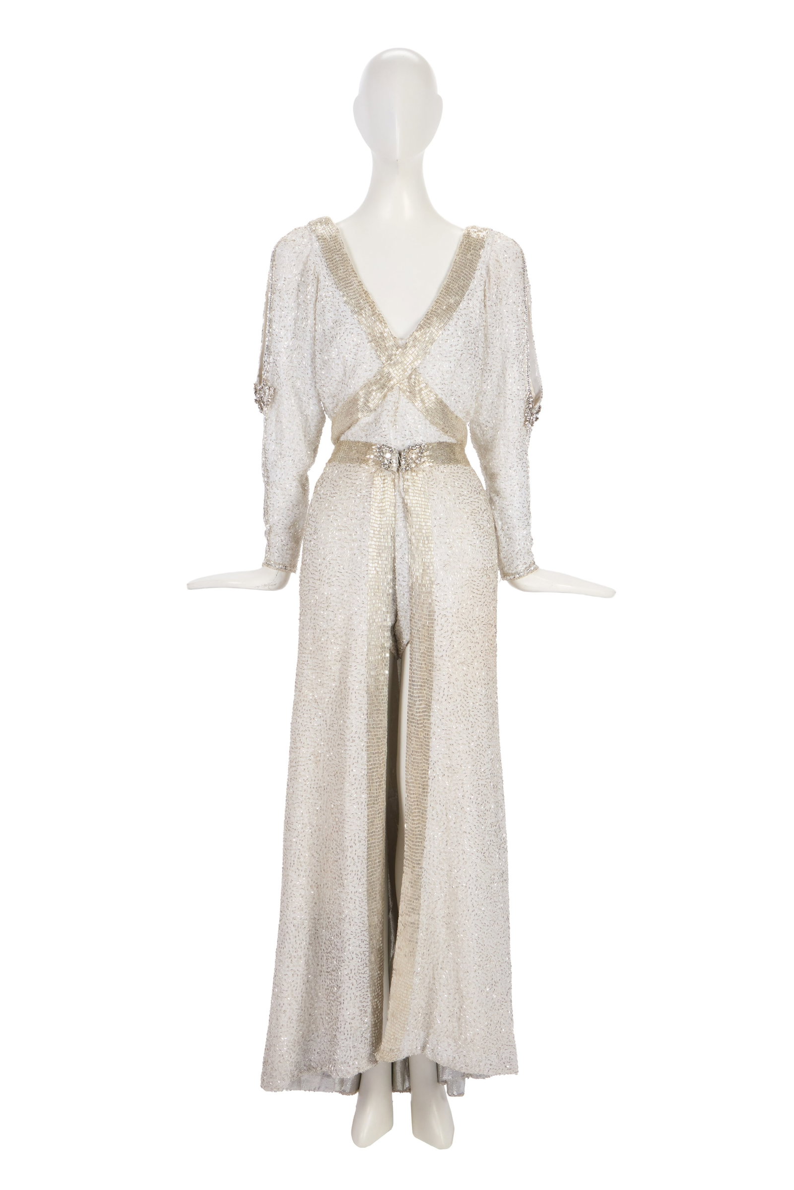 Ann-Margret | 1980s Stage-Worn White Costume: A stunning and heavy two-piece ensemble; comprising a hot pants jumper, made of iridescent white silk, long sleeves with added large rhinestone detailing at the elbow on either side, plunging V neck