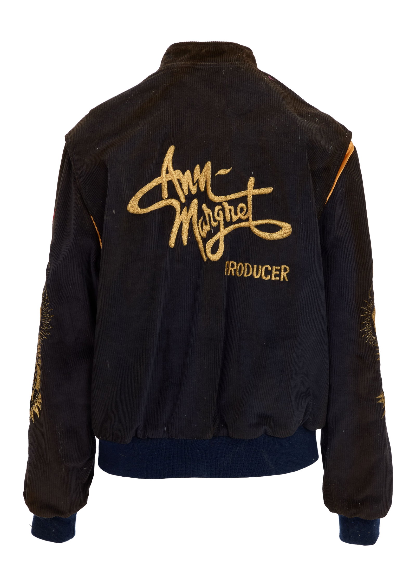 Ann-Margret | 1980s Roger Smith Crew Jacket: A garment made of black corduroy; gold-embroidered dragons stitched down either sleeve, back reads "Ann- / Margret / Producer," label reads "Jonathan B. / California"; worn by the star's husband when 