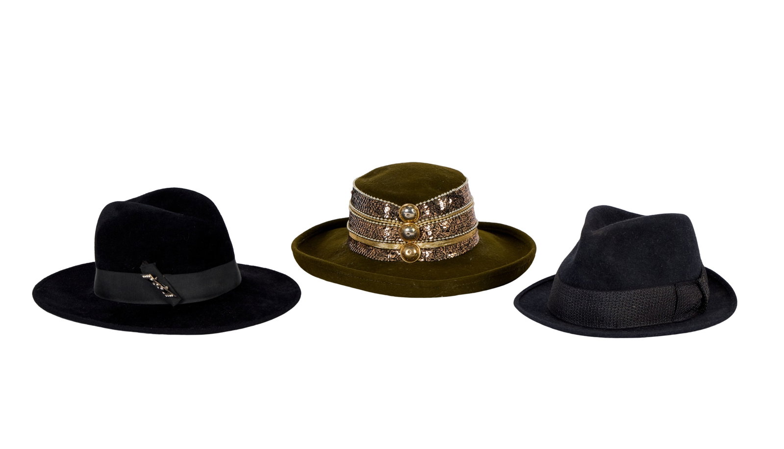 Ann-Margret | 1970s-1980s Winter Hats: A group of three; the first made of black velvet, wide black silk grosgrain hatband with added marcasite brooch, interior stamped in part "Launcelot," further store label reads "Georgi"; the second