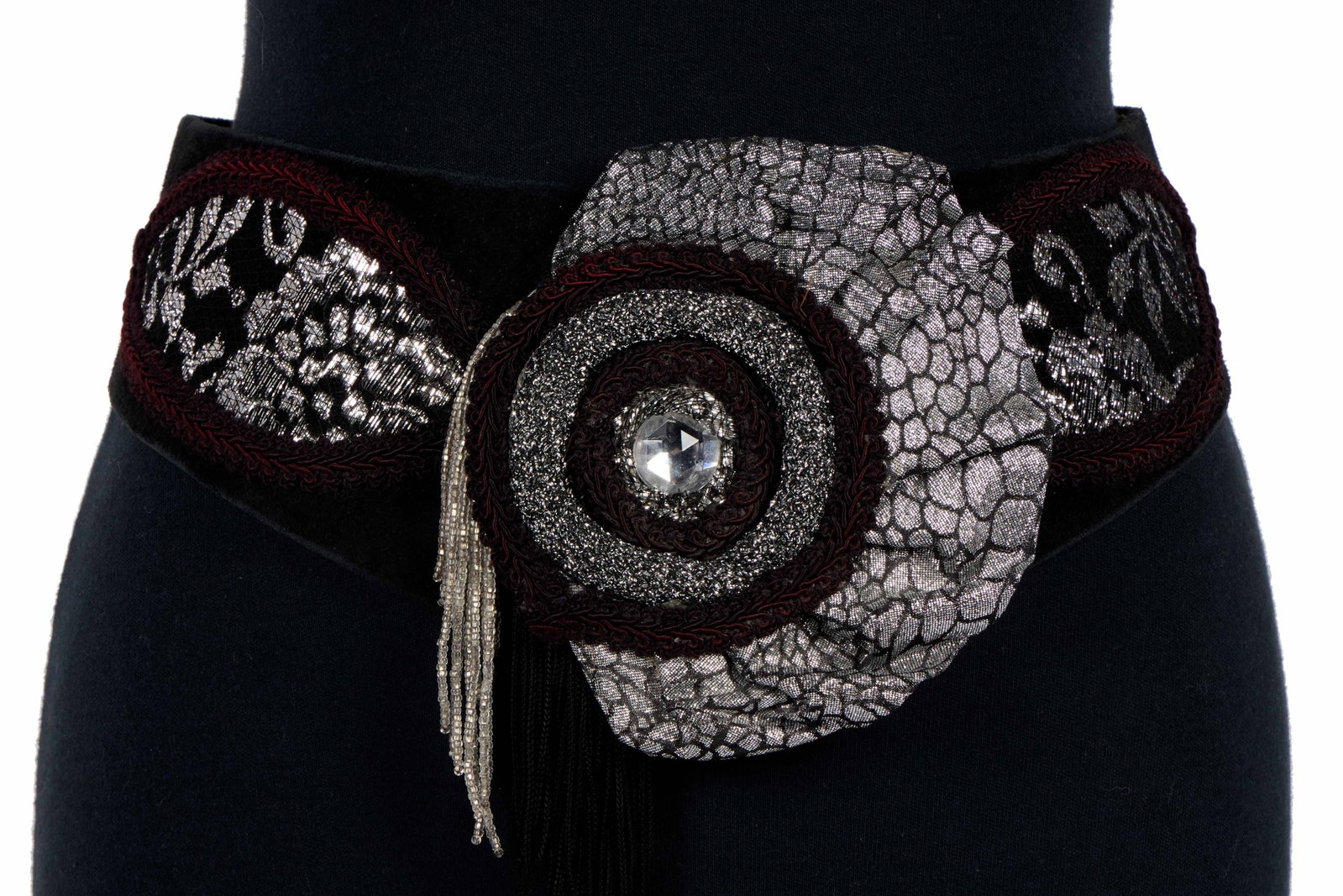 Ann-Margret | 1980s Belts: A group of five; all cummerbund-styles; two red fabric, one black suede with fabric and rhinestone adornment, one black fabric, and one off-white with brown and white bugle beads; also included is a
