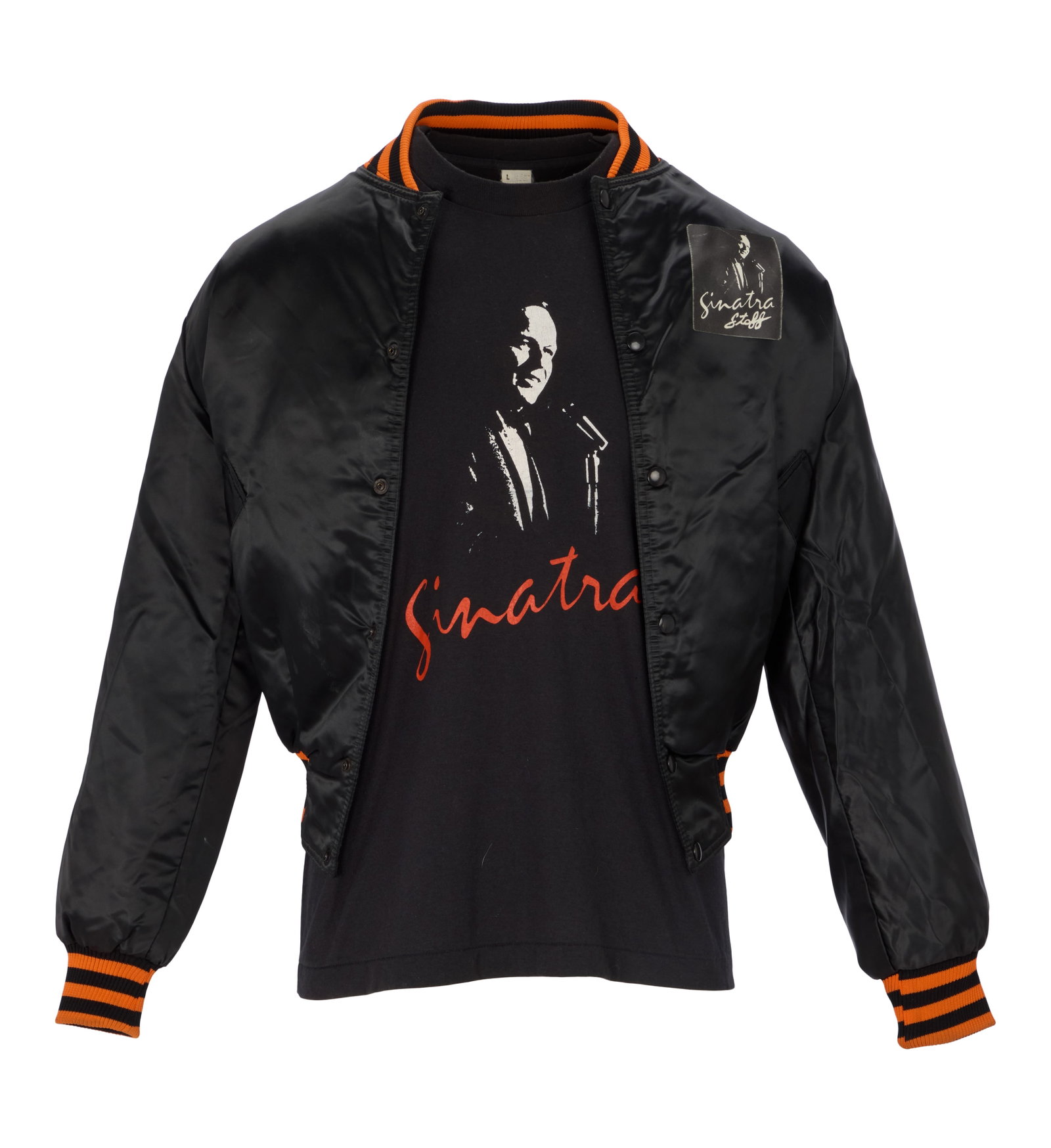 Frank Sinatra | 1981 Tour Jacket and T-Shirt: A group of two items; the first a black satin bomber-style jacket, orange and black striped trim, front with patch reading "Sinatra / Staff," back with orange stitching reading "Sun City /