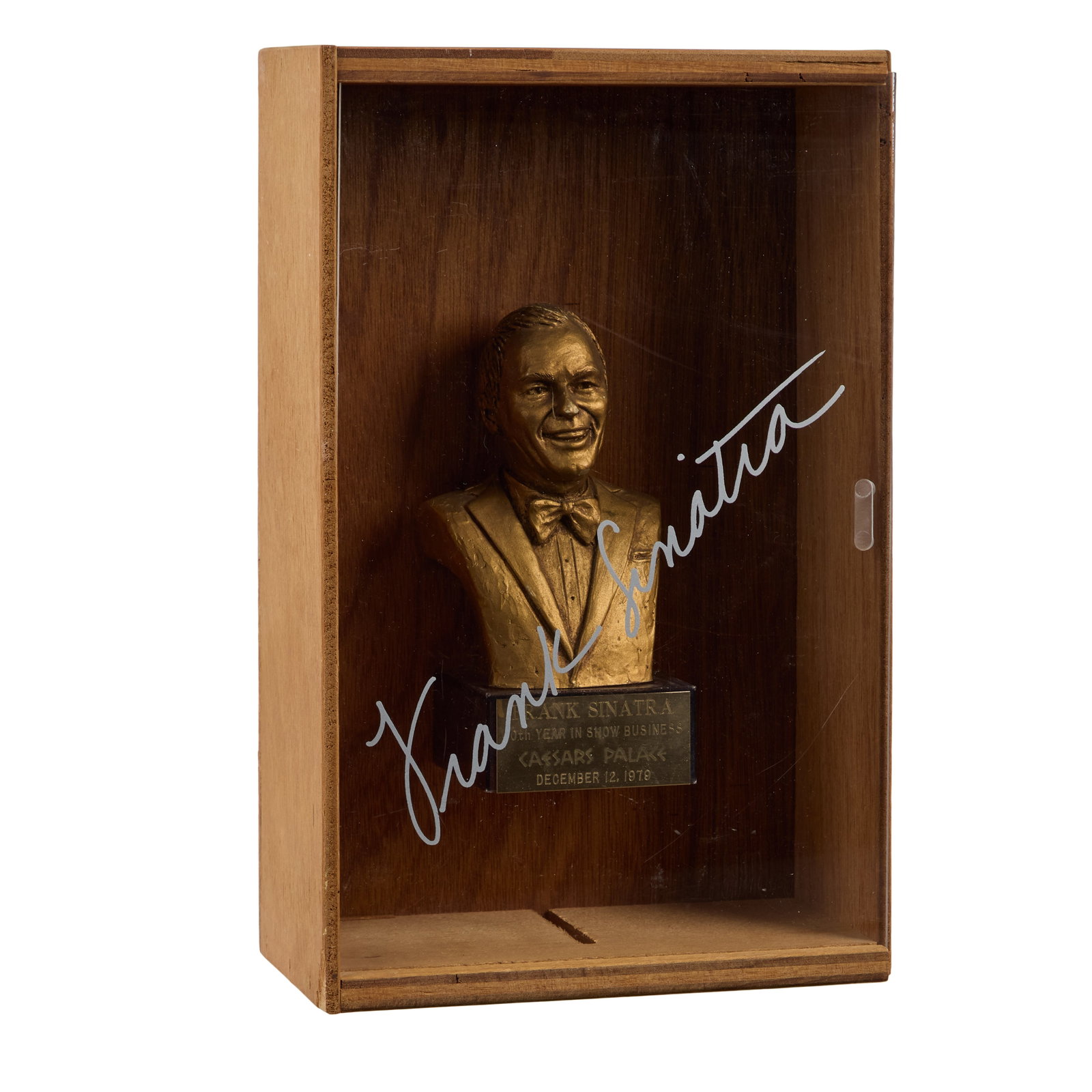 Frank Sinatra | 1979 Small Memento in a Shadowbox: A small gold-tone resin bust of the singer; gifted to attendees at the Caesars Palace event that celebrated the singer's "40th Year in Show Business" on December 12, 1979" in Las Vegas; housed in a