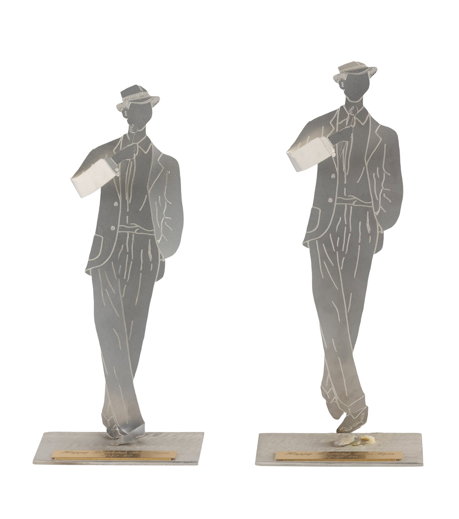 Frank Sinatra | 1990 Small Standees from His 75th Birthday Celebration: A group of two; identical; made of silver-tone metal forming an abstract image of the singer holding a microphone, one has the artist's name on shoe "Pascal," rectangular-shaped base with a plaque
