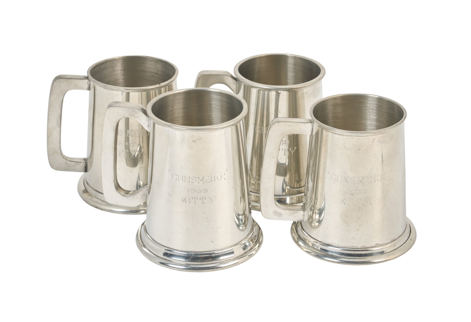 Gunsmoke | 1960s Four Miss Kitty Metal Tankards (B): CBS, 1955-1975. A collection of four metal commemorative tankards given to Amanda Blake, who portrayed the beloved character Miss Kitty on the beloved TV western for twenty years. These tankards were
