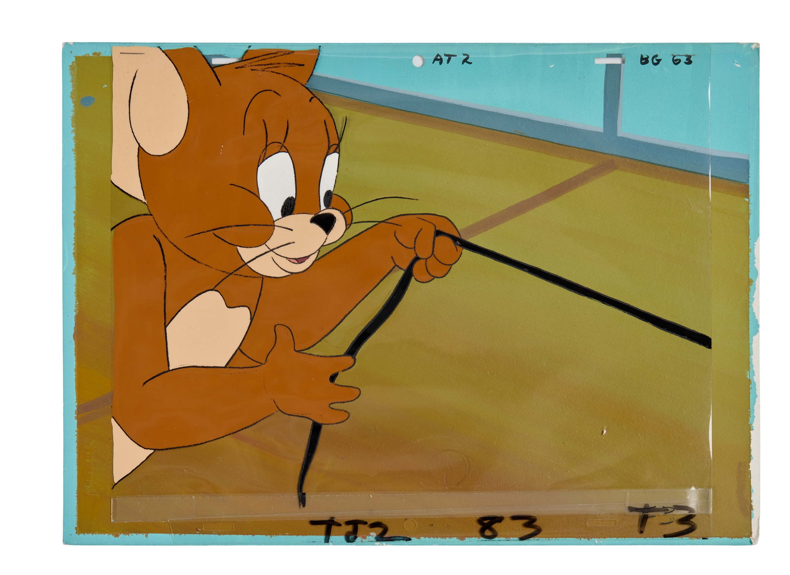 Tom and Jerry | Jerry Animation Cel with Background: An animation cel and background featuring the mouse Jerry, from the long running series of Tom and Jerry cartoons. The animation cel features handwritten text which reads, "TJ2 83 T3." The background