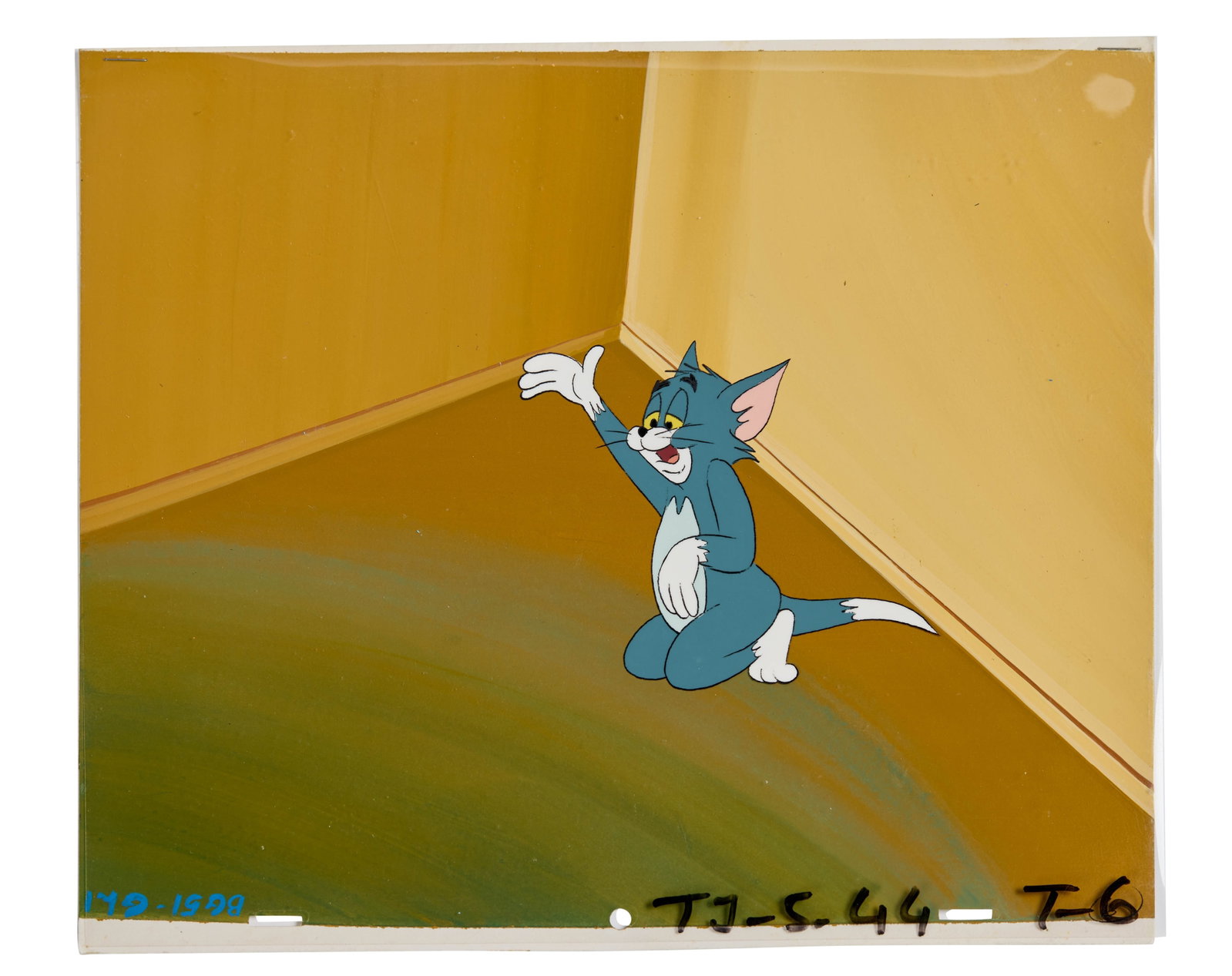 Tom and Jerry | Tom Animation Cel with Background: An animation cel and background featuring the Cat Tom, from the long running series of Tom and Jerry cartoons. The animation cel features handwritten text which reads, "TJ-5-44 T-6." The background