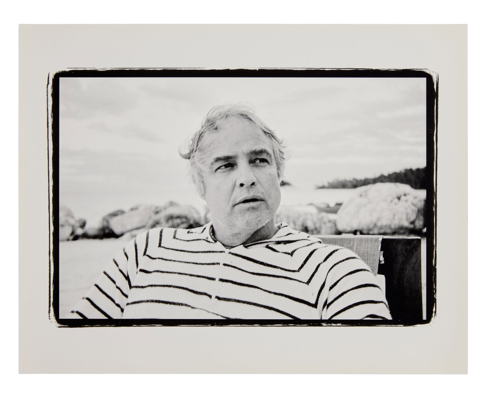 Marlon Brando | 1978 Portrait by Lawrence Grobel (E): Original print, double-weight paper, matte finish. A black and white portrait of Marlon Brando at his Tahitian atoll, Teti'aroa. This photograph of the star was taken by journalist Larry Grobel, who