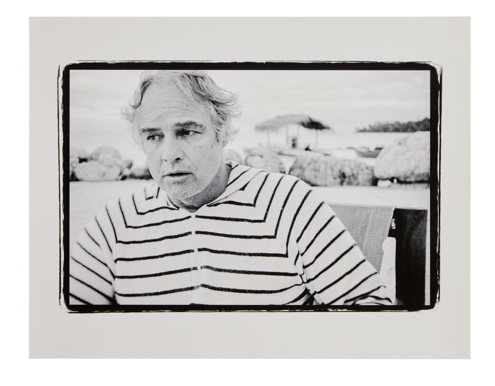 Marlon Brando | 1978 Portrait by Lawrence Grobel (A): Original print, double-weight paper, matte finish. A black and white portrait of Marlon Brando at his Tahitian atoll, Teti'aroa. This photograph of the star was taken by journalist Larry Grobel, who
