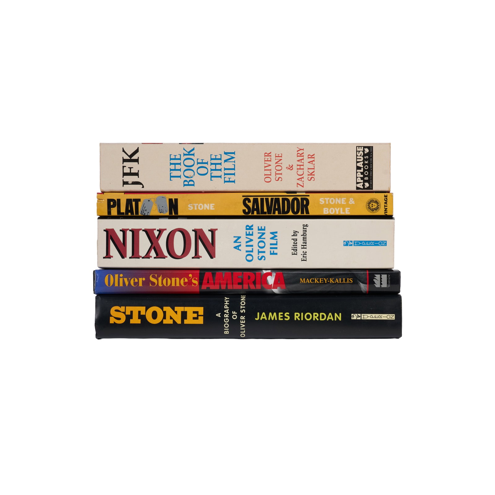 Oliver Stone | Five Signed Books: Five books signed by Oliver Stone, all from the collection of Hollywood journalist Larry Grobel. RIVELE, STEPHEN J.; WILKINGSON, CHRISTOPHER; STONE, OLIVER. Nixon: An Oliver Stone Film. New York: