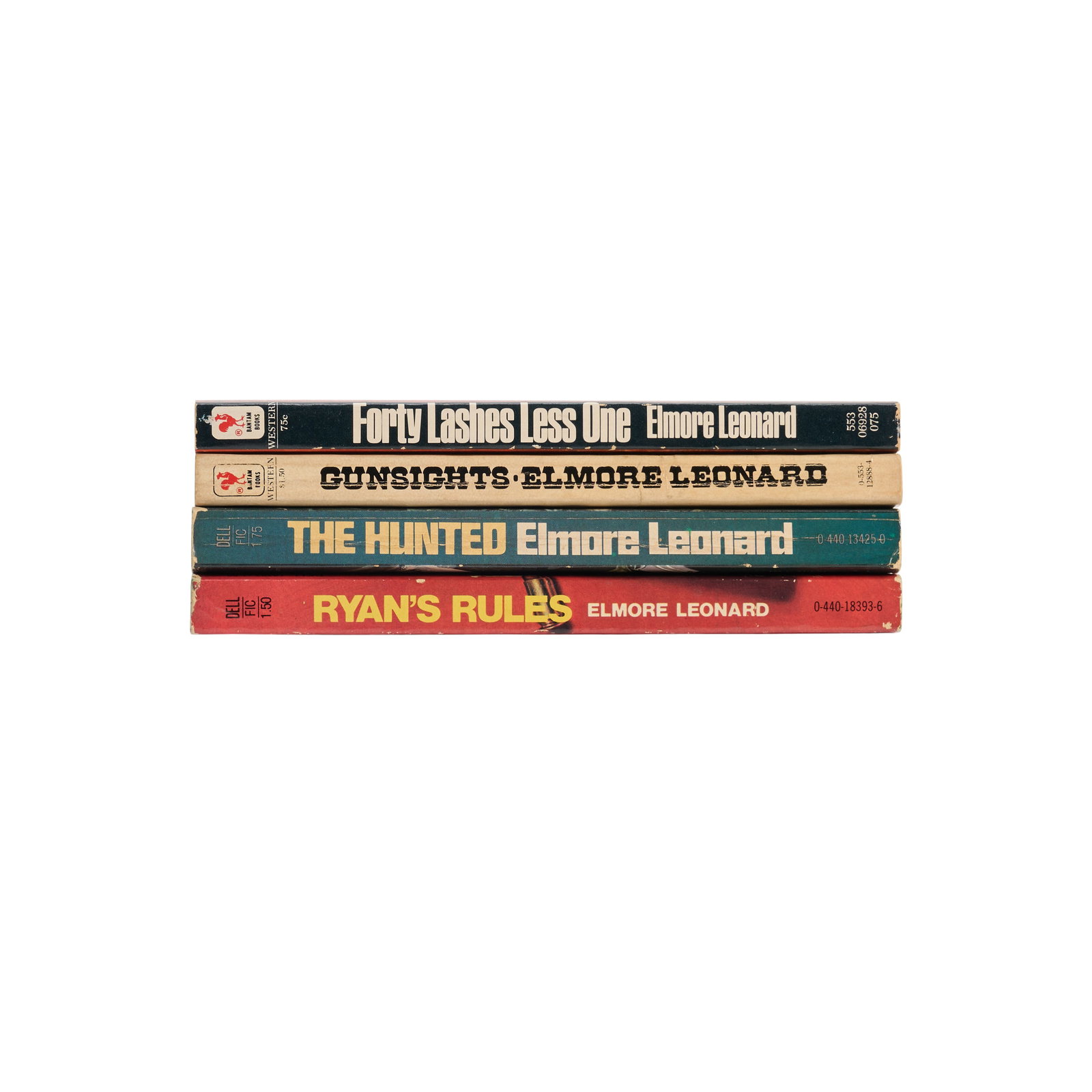 Elmore Leonard | Four Books Signed to Lawrence Grobel: LEONARD, ELMORE. Ryan's Rules. New York: Dell Publishing Co., Inc., 1978. 12mo. Softcover. Light shelf wear to spine, mild creasing at corners of cover. First Dell printing. Originally published