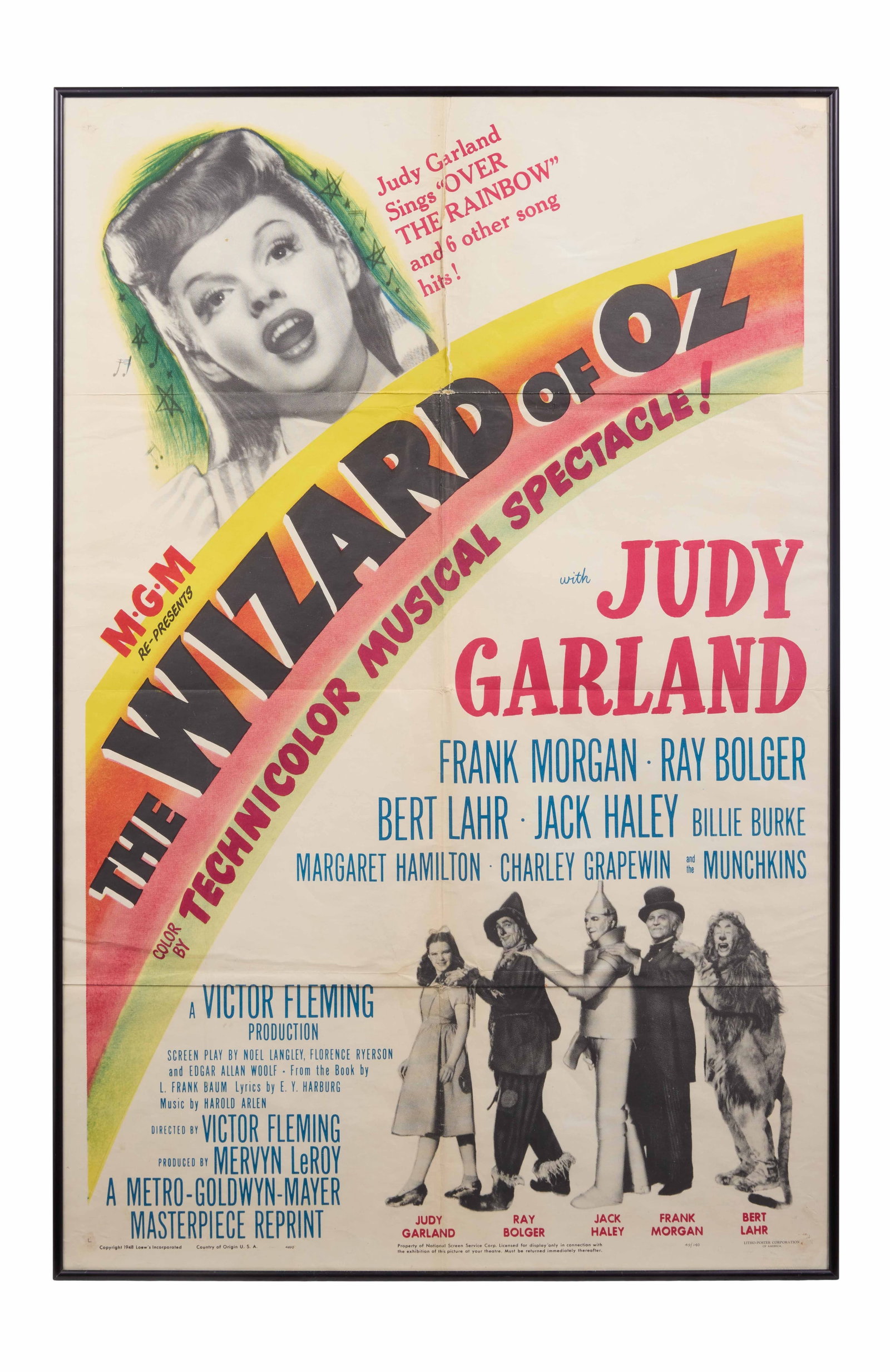 The Wizard of Oz | Movie Poster: MGM, R-1949. One-sheet poster, 41" x 27", tri-folded. Significant creasing along folds. Torn upper right corner. Discoloration at lower corners and along edges. A poster from the re-release of the
