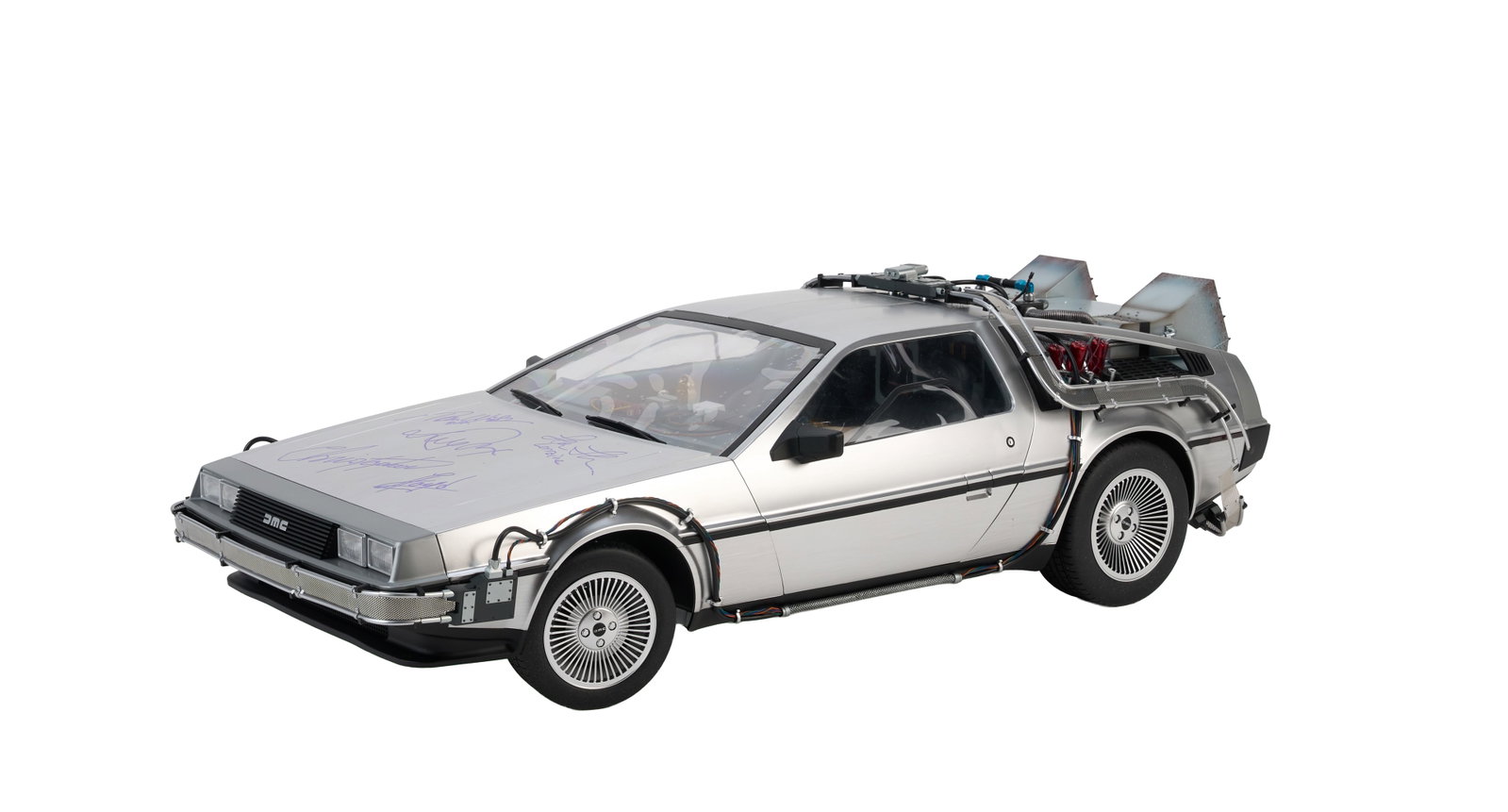 Back to the Future Part II | Cast-Signed 1:6 Scale DeLorean Time Machine Model: A 1:6 scale Hot Toys DeLorean time machine model featuring the configuration from Back to the Future Part II (Universal Pictures, 1989), signed by cast members Michael J. Fox, Christopher Lloyd, and