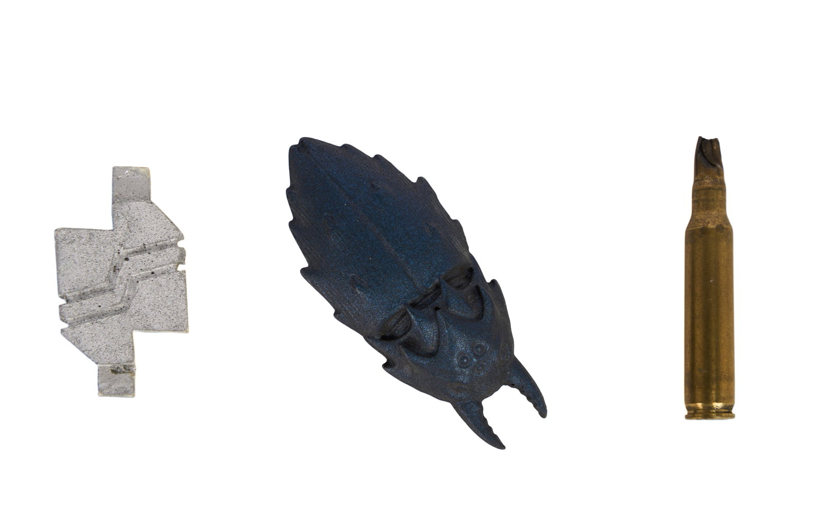 Stargate SG-1 | Assorted Prop Group: A group of three small props from the production of Stargate SG-1 (Showtime, 1997-2002; Sci-Fi, 2002-2007) including: - A shell casing used to kill the Replicators in the third season episode
