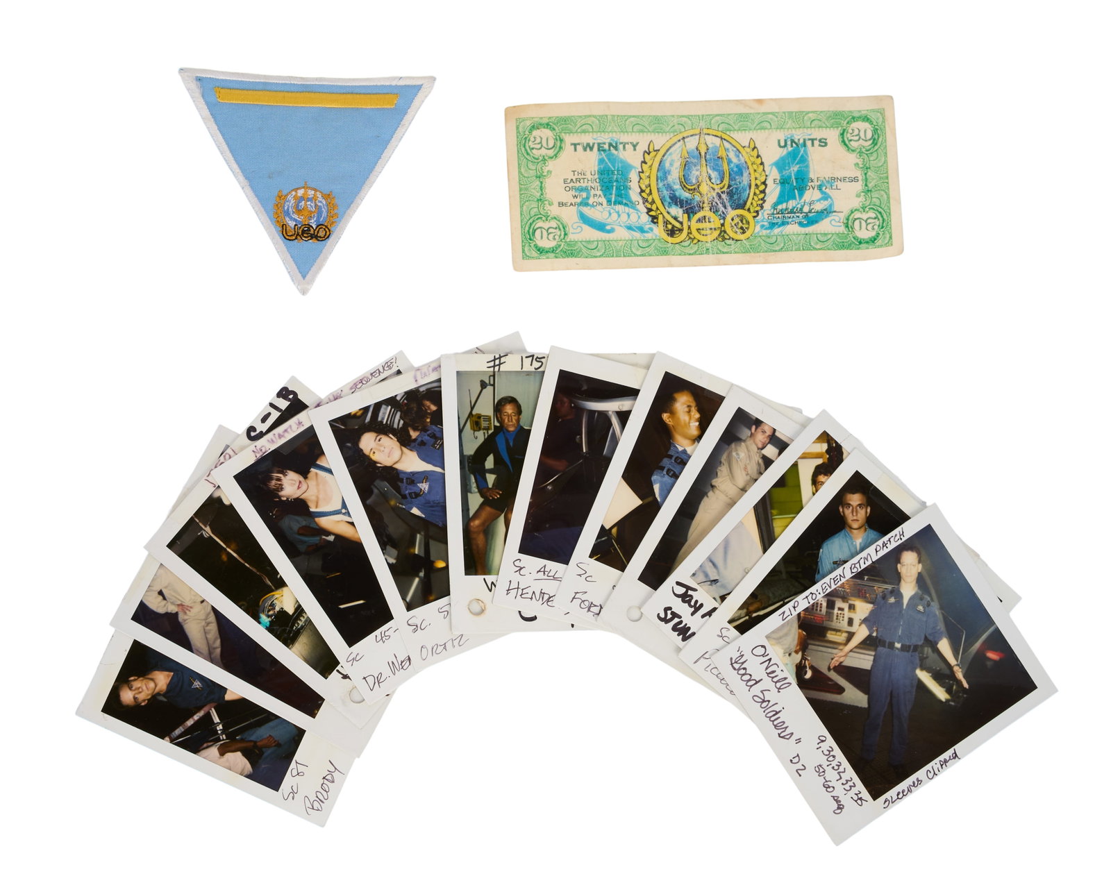 SeaQuest DSV | Ephemera and Photo Group: A group of items from the production of the television series SeaQuest DSV (NBC, 1993-1996) including a United Earth Oceans Organization (UEO) twenty units prop bank note; a blue, yellow, and